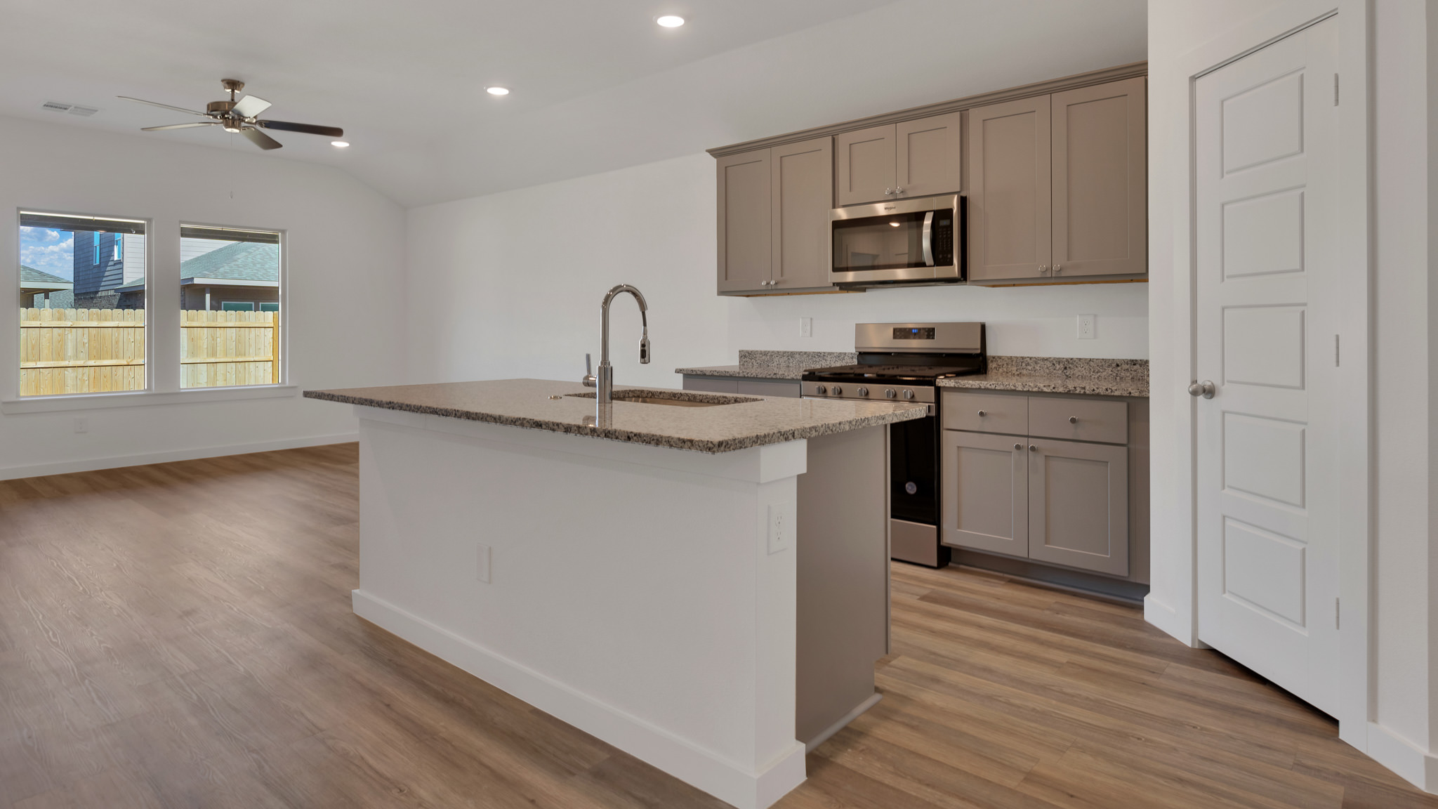 Open concept kitchen with ample lighting