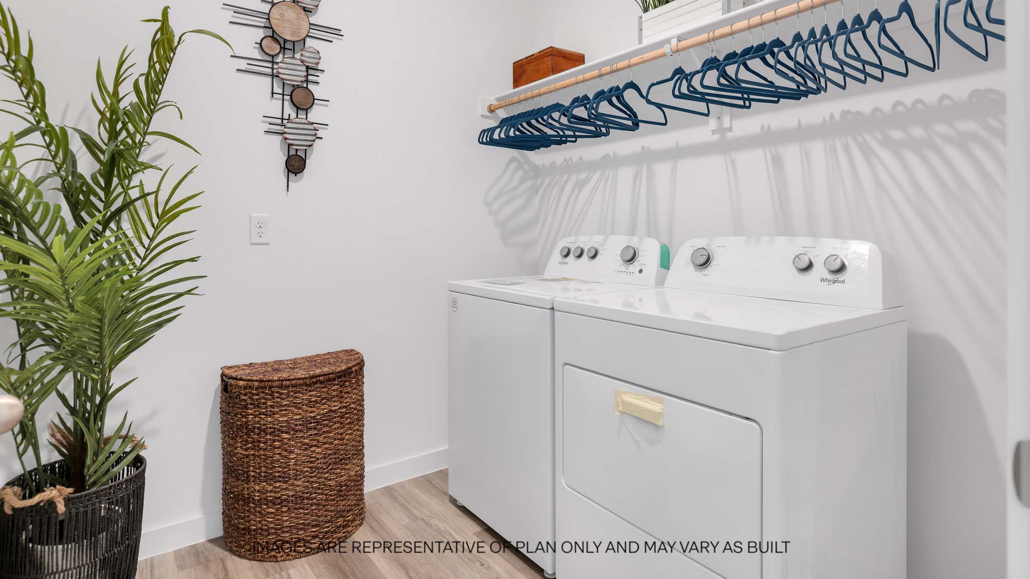 Laundry room and utility closet space with extra storage