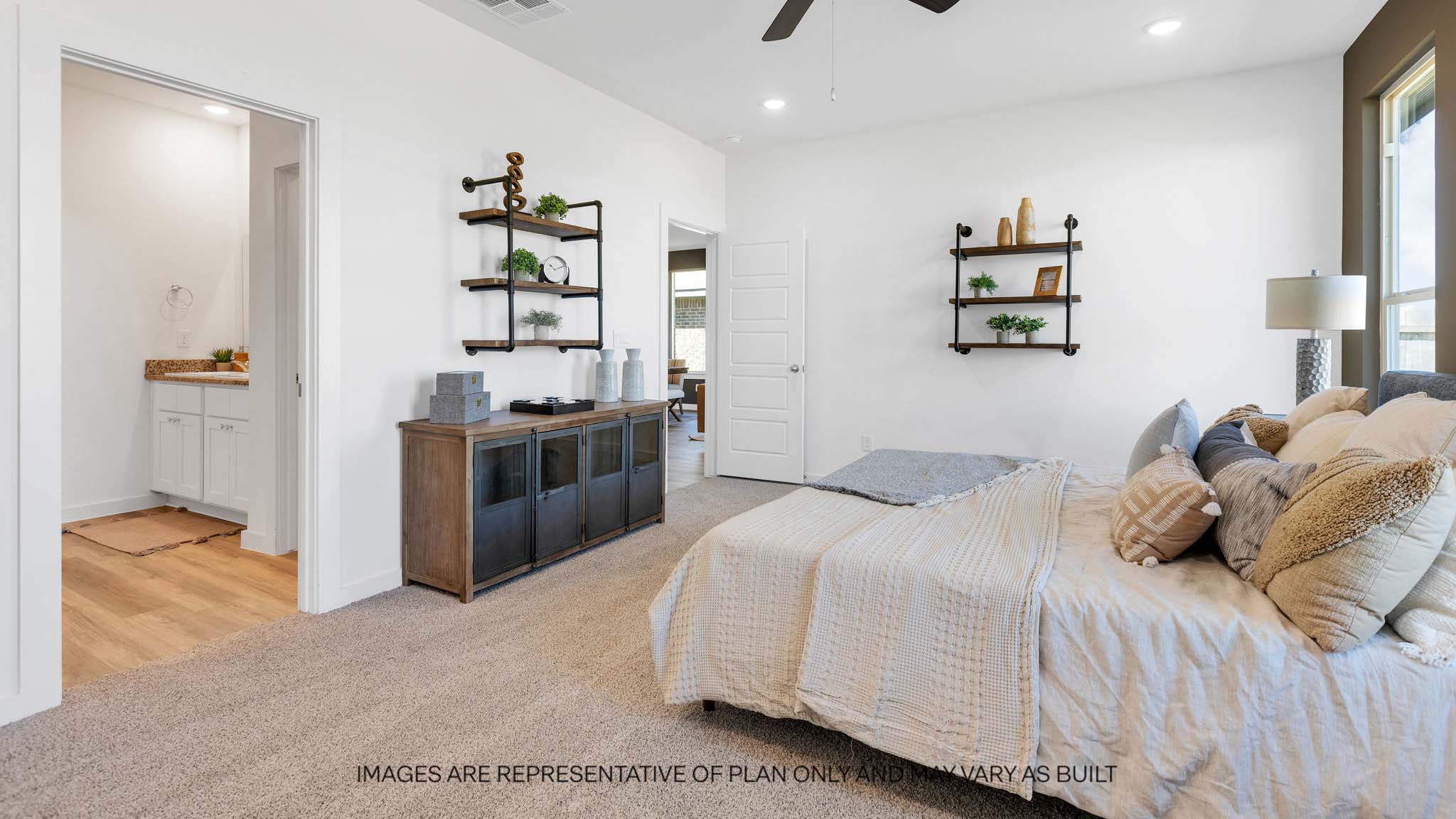 Primary bedroom with private attached bathroom and walk-in closet