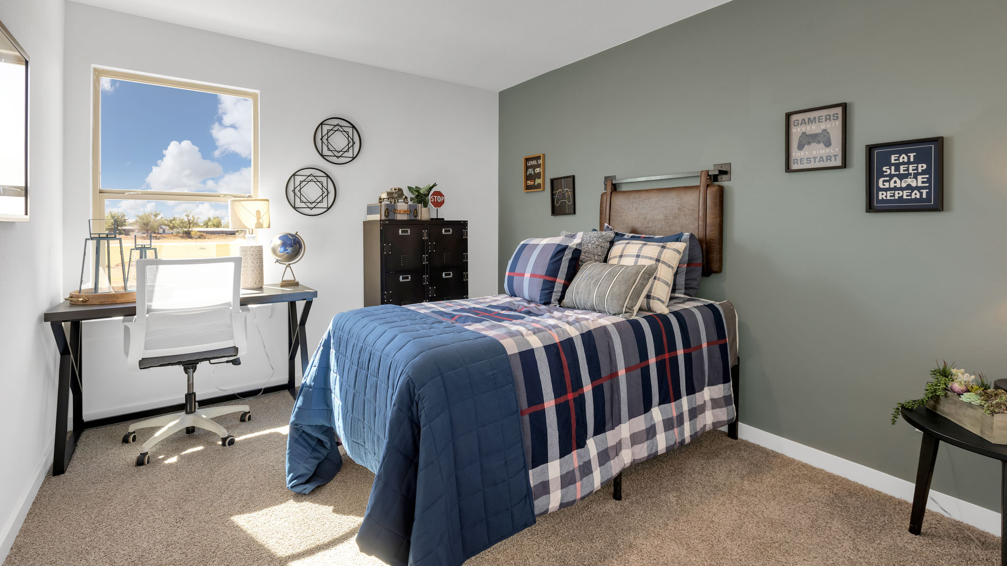 Guest bedroom with side window and plush carpet floor