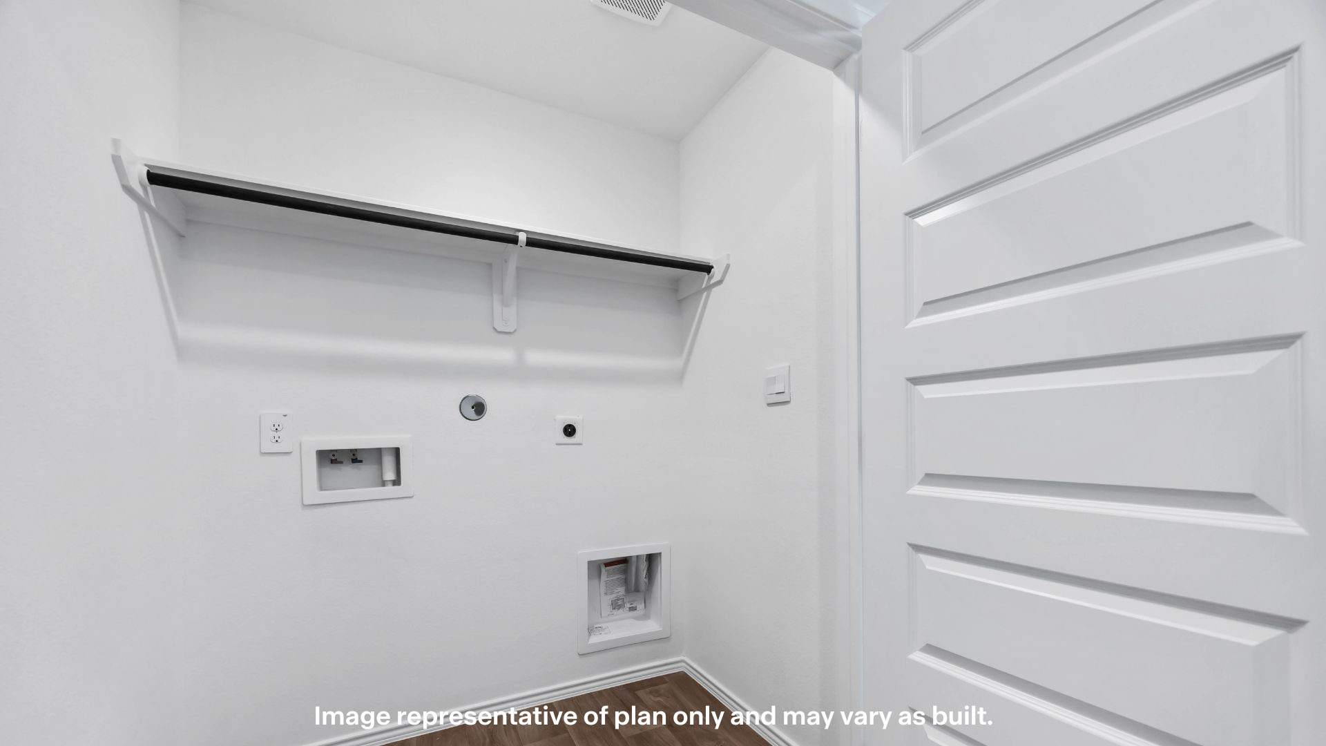 utility closet for washer and dryer hookups, extra storage space shelf above.