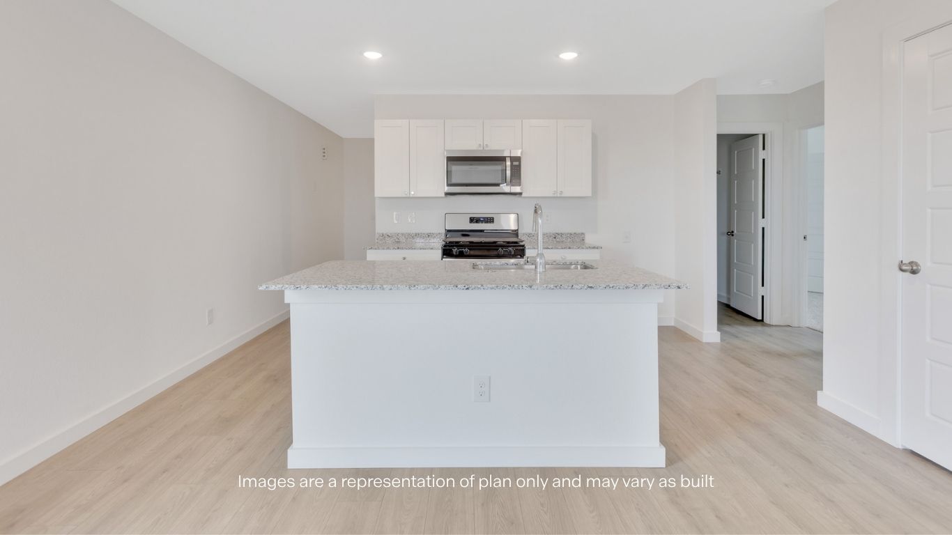 Spacious open concept kitchen with island and counter prep space