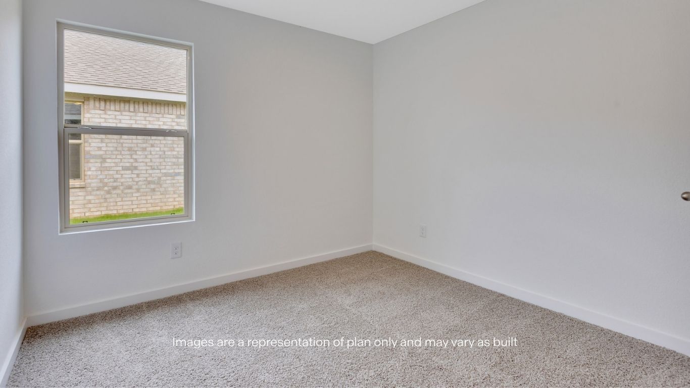Guest bedroom with side window and plush carpet floor