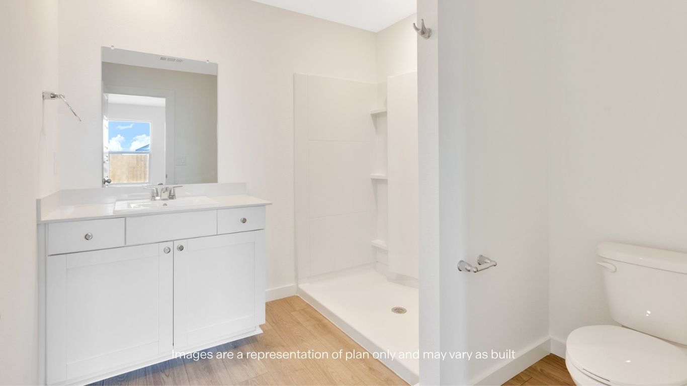 Primary bathroom with luxurious shower and built in storage
