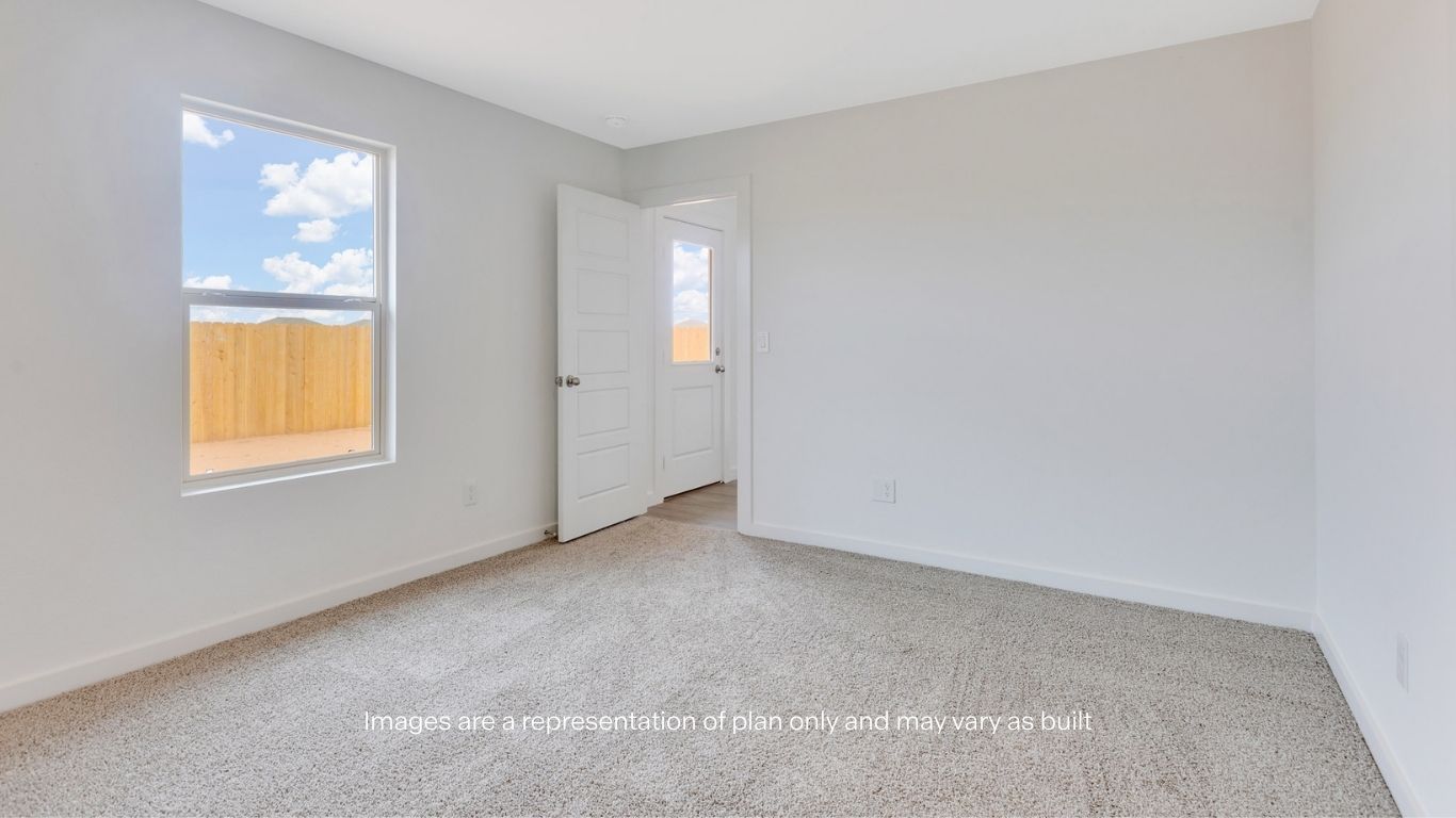 Primary bedroom with private attached bathroom and walk-in closet