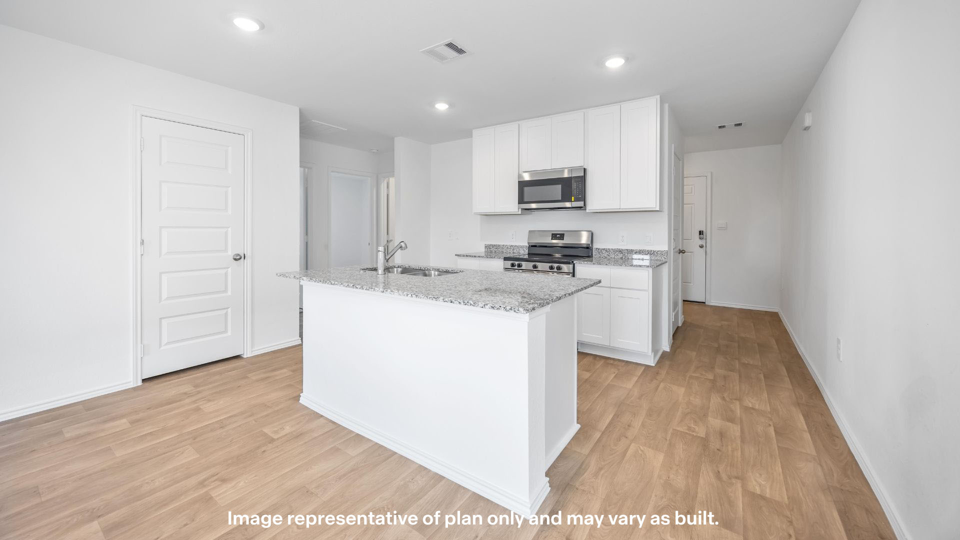 Spacious open concept kitchen with island and counter prep space