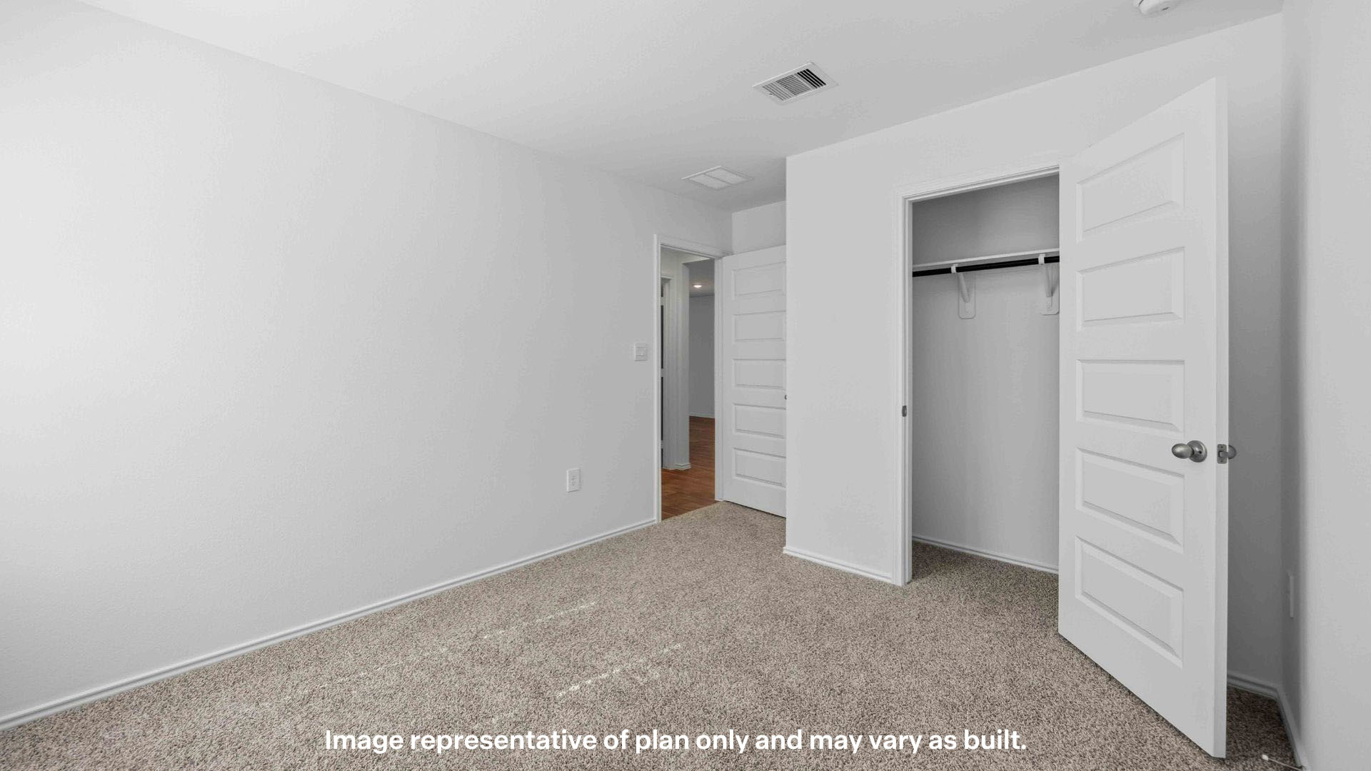 Guest bedroom 2 with plush carpet floors and spacious closet