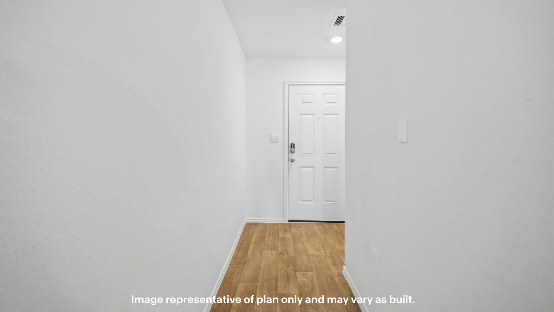 Entry hallway leading to kitchen area