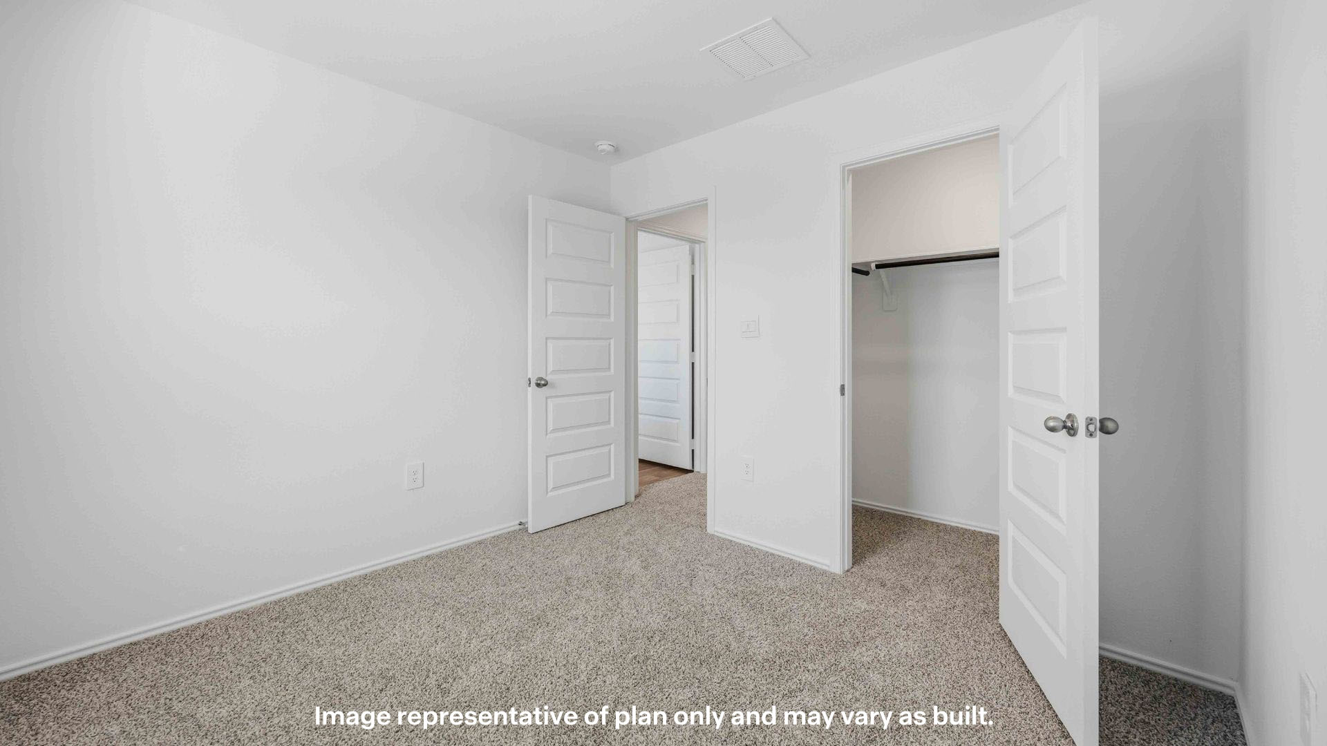 Guest bedroom 2 with plush carpet floors and spacious closet
