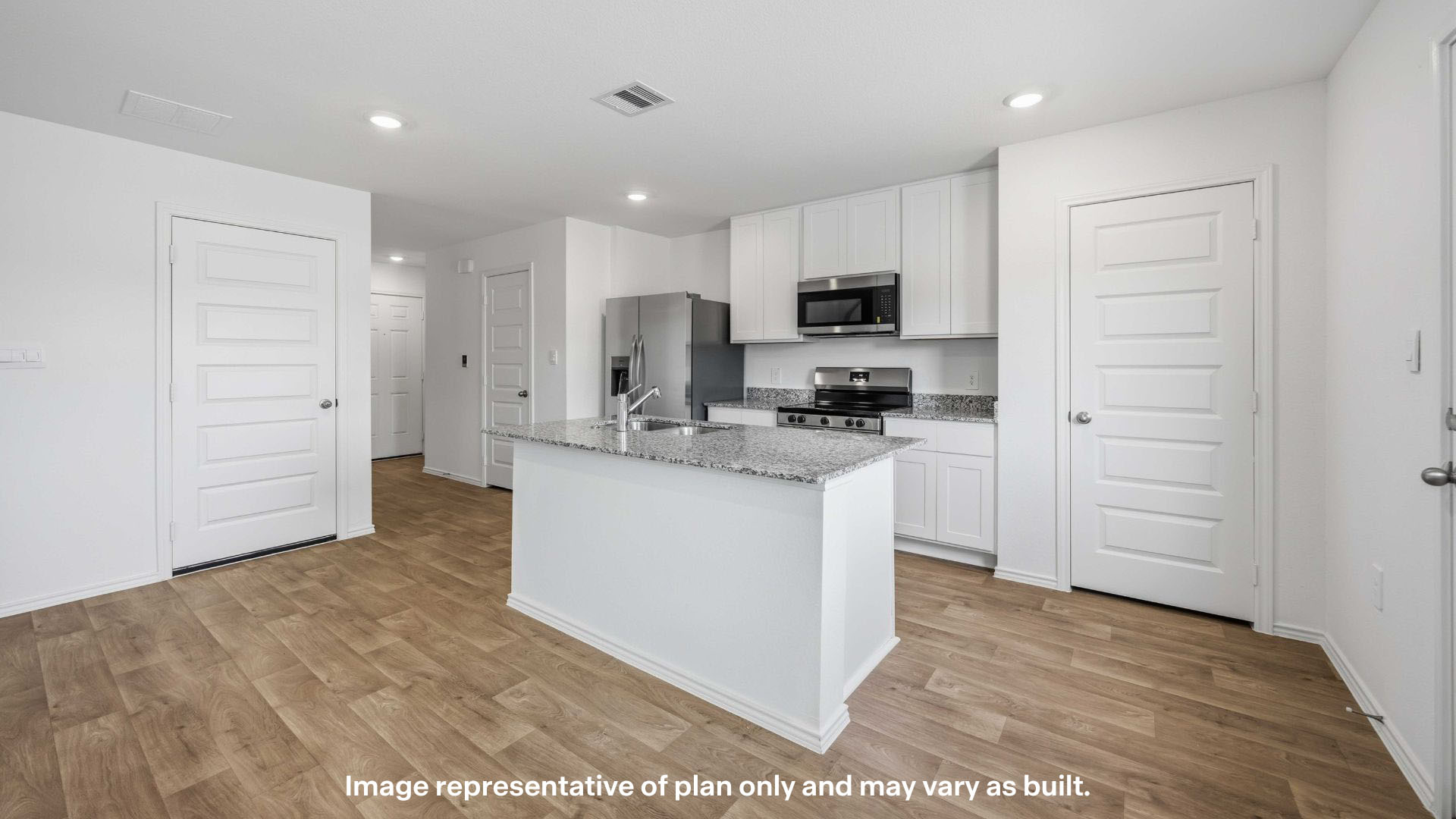 Spacious open concept kitchen with island and counter prep space