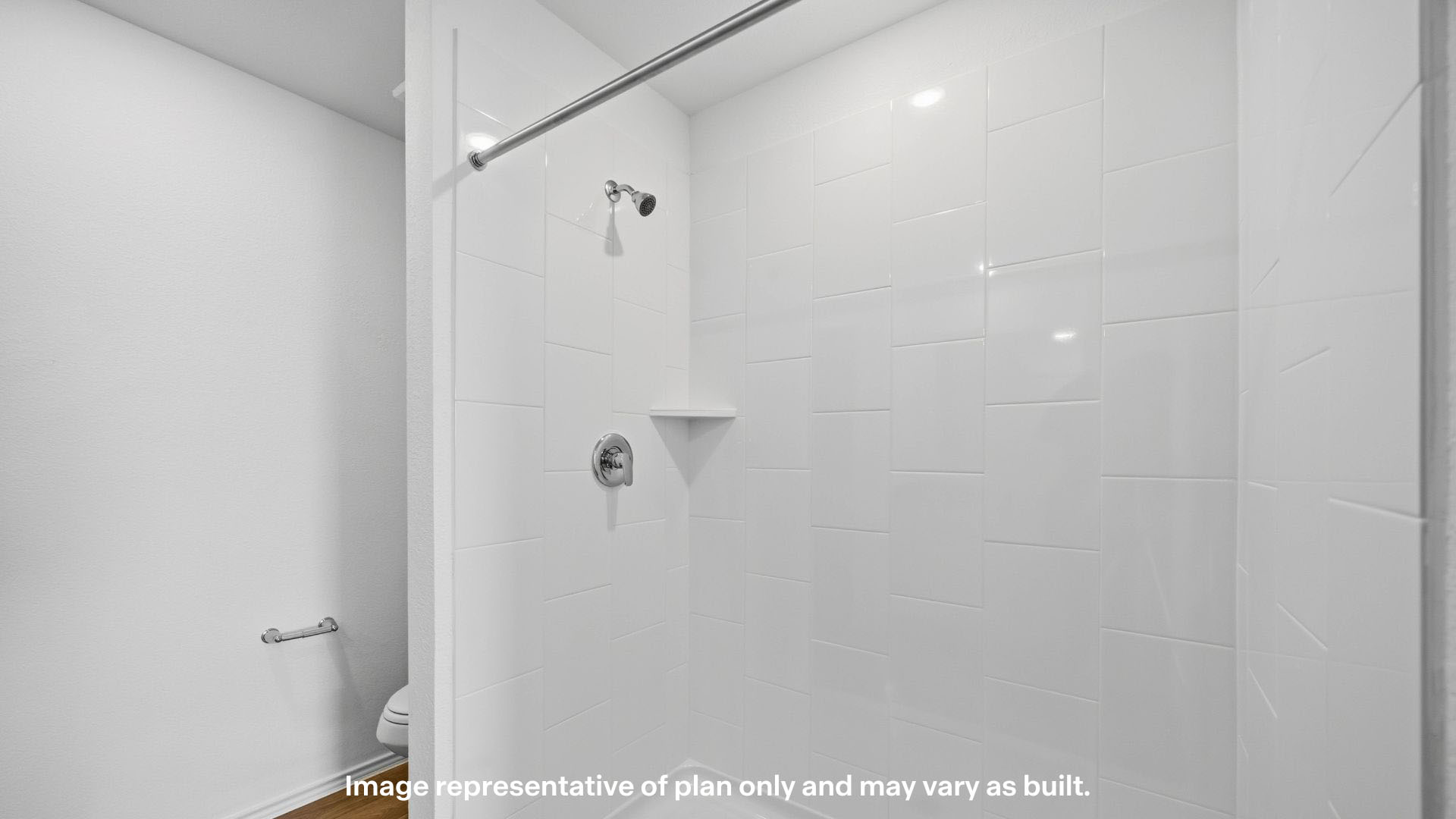 Private attached primary bathroom with built in vanity and luxurious shower