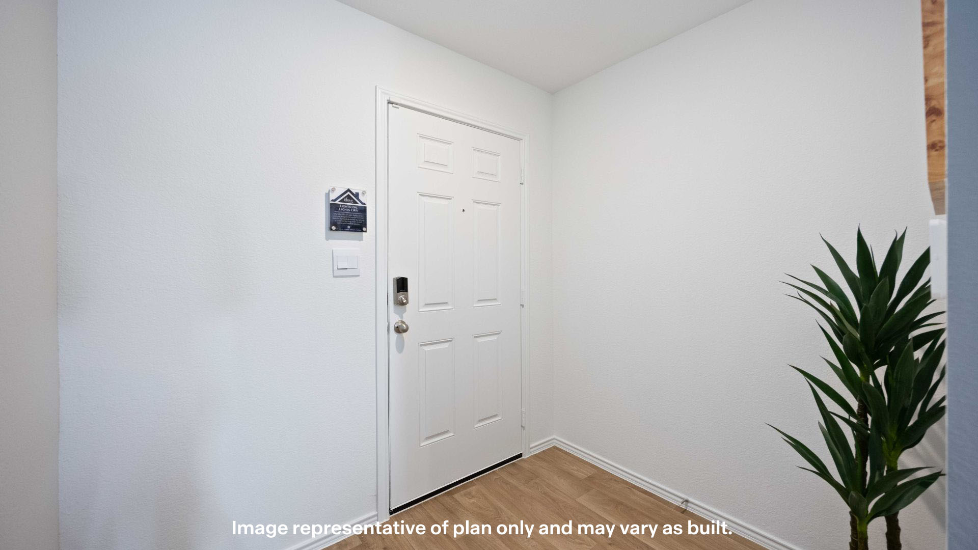 Entry foyer leading to kitchen area