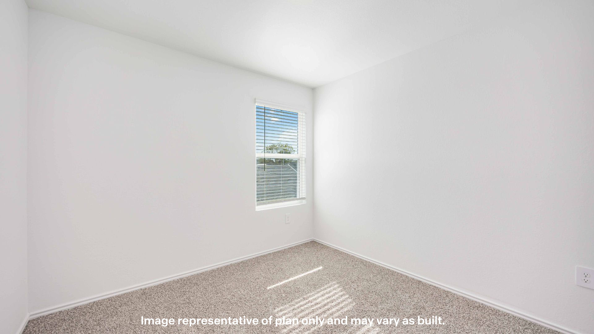 Guest bedroom with side window and plush carpet floor