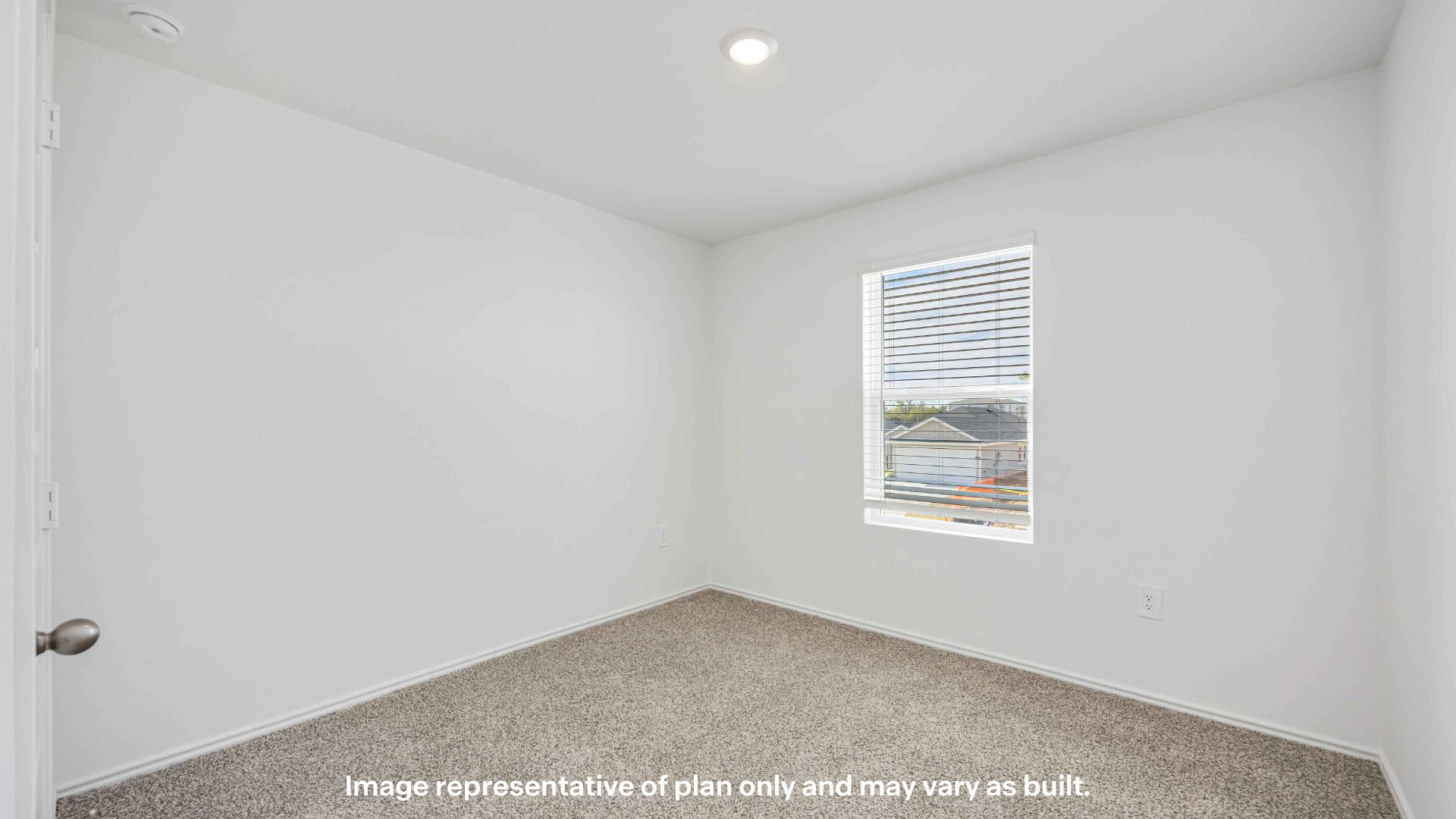 Guest bedroom with side window and plush carpet floor