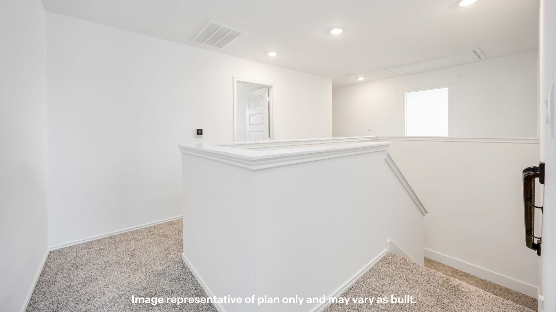 upstairs landing space surrounded by bedrooms and laundry room