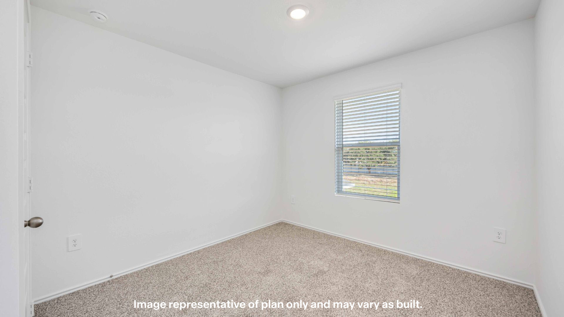 Guest bedroom with side window and plush carpet floor