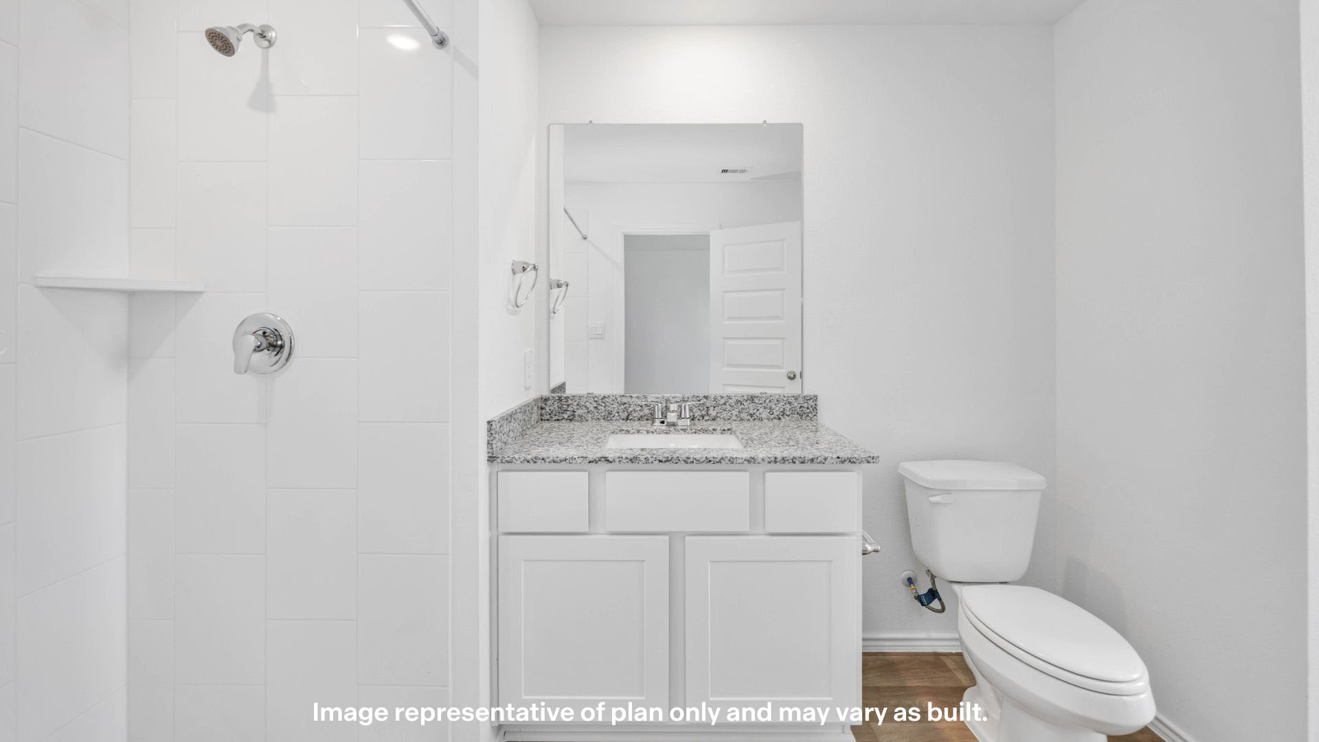 Private attached primary bathroom with built in vanity and luxurious shower