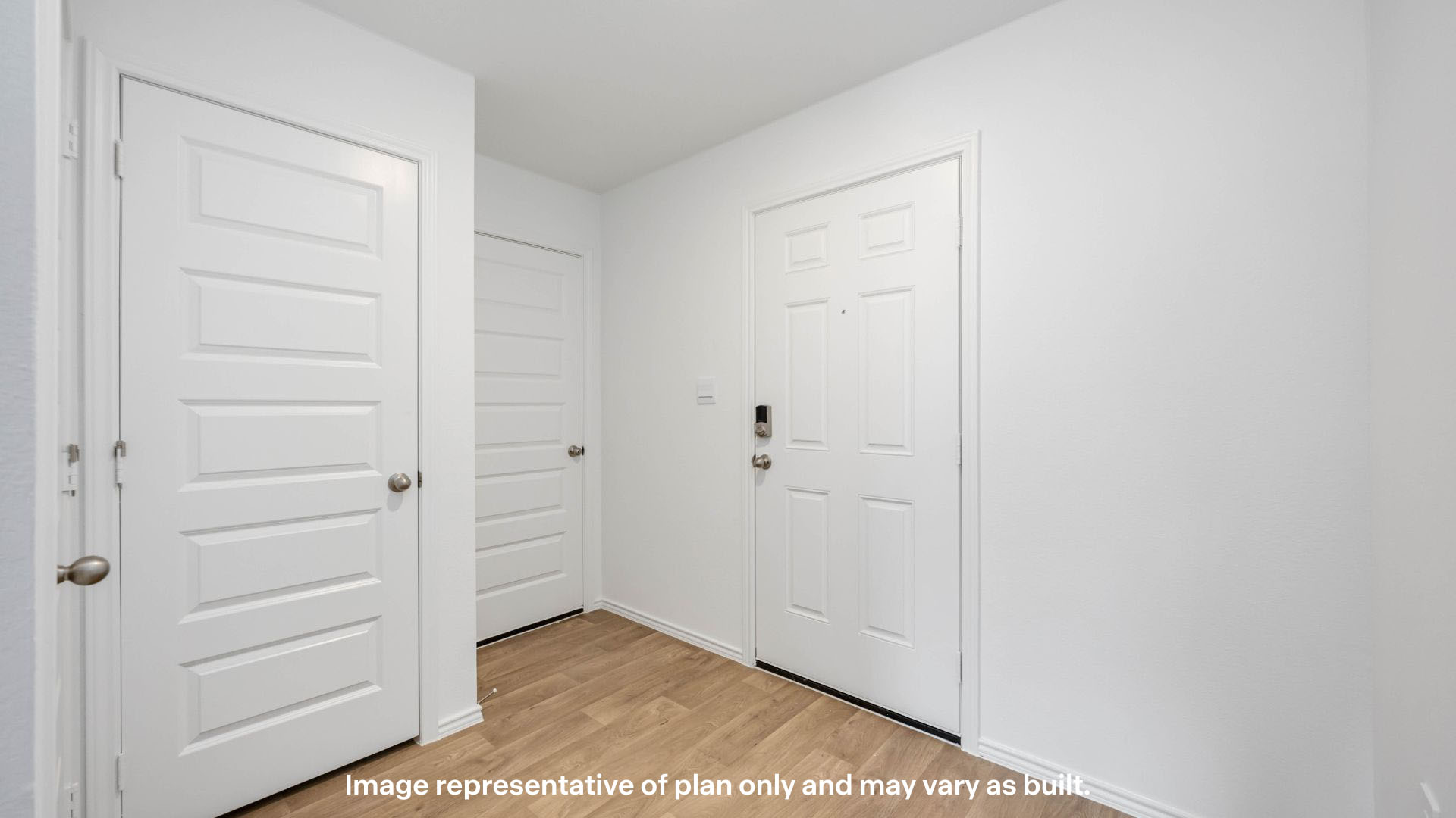 Entrance foyer with half bath and coat closet