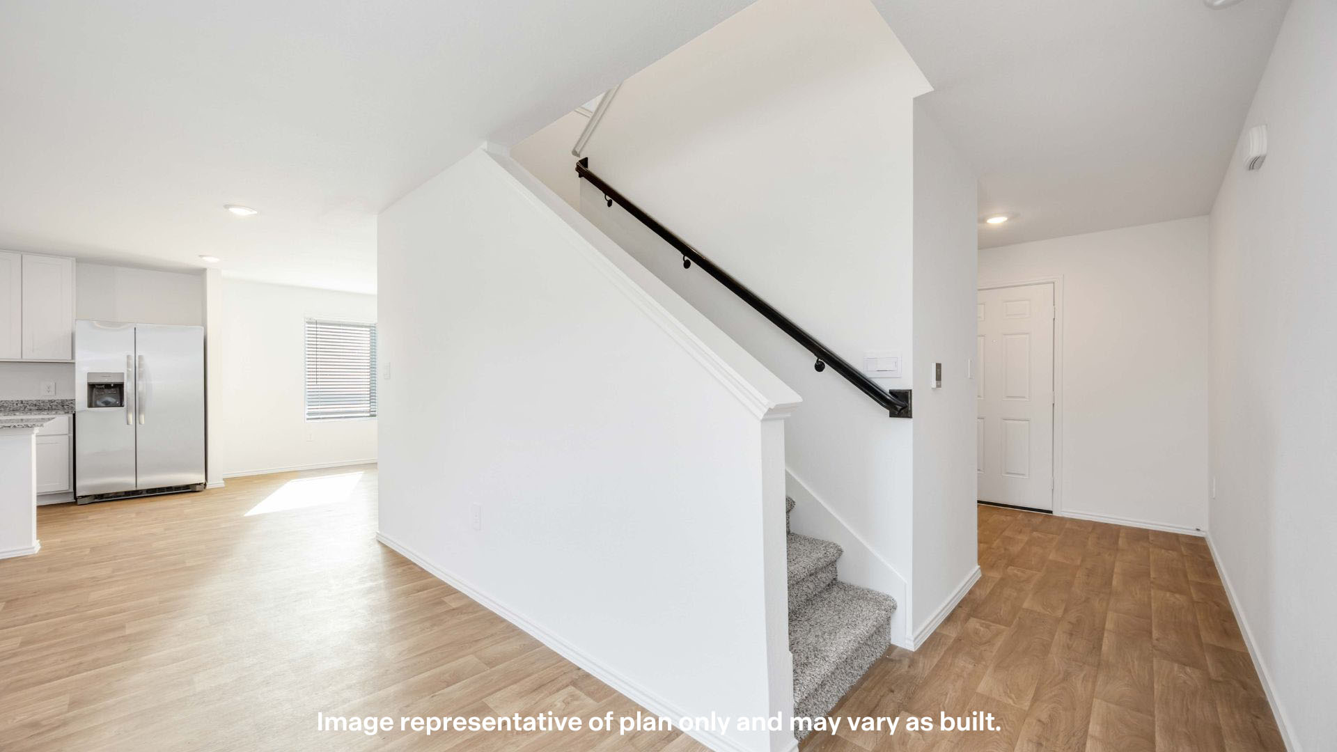 Foyer with staircase to the side of hallway