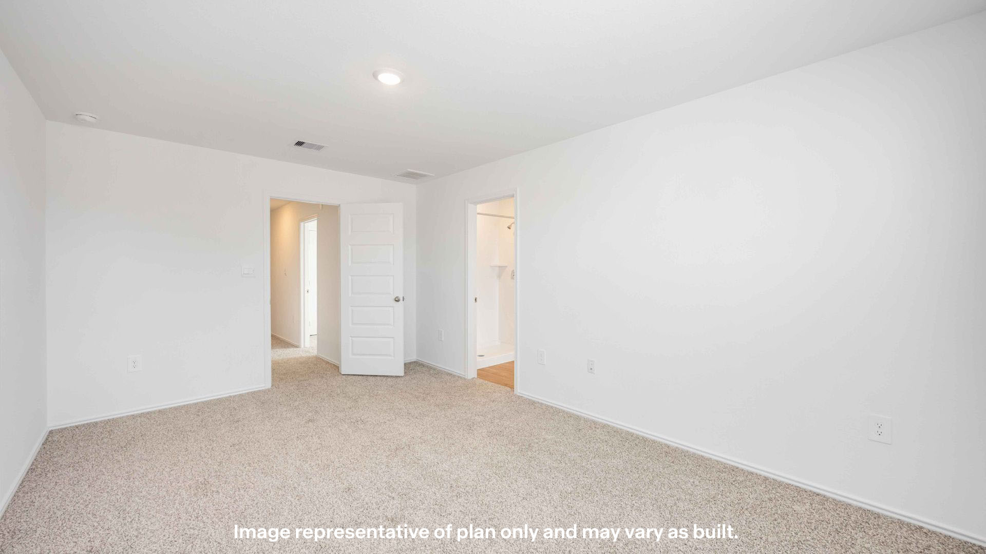 Primary bedroom with private attached bathroom and walk-in closet