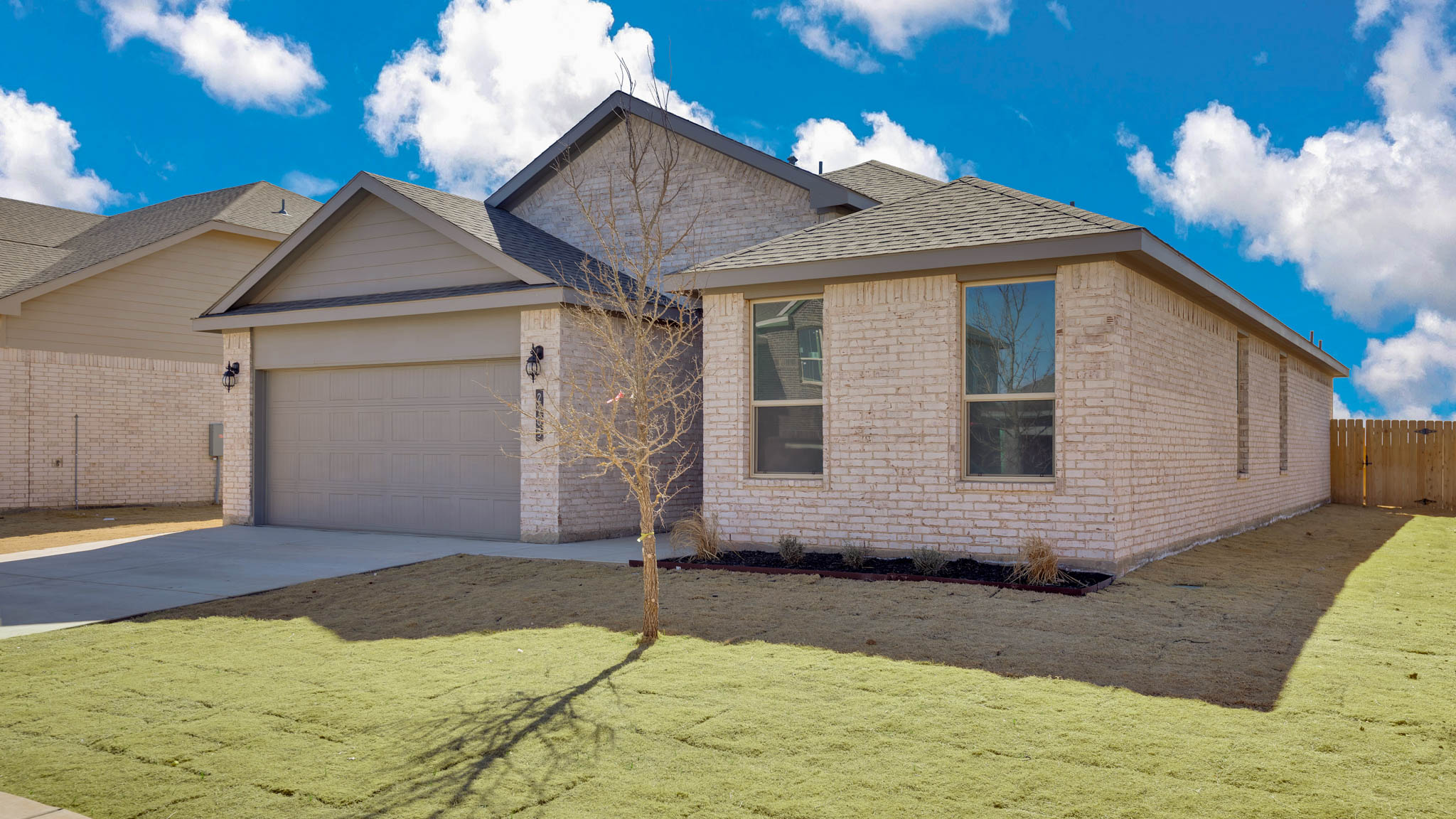Side view of single story timeless brick home