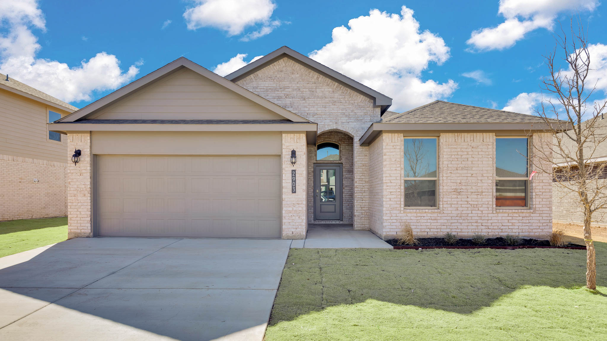 Exterior of single story modern brick style home