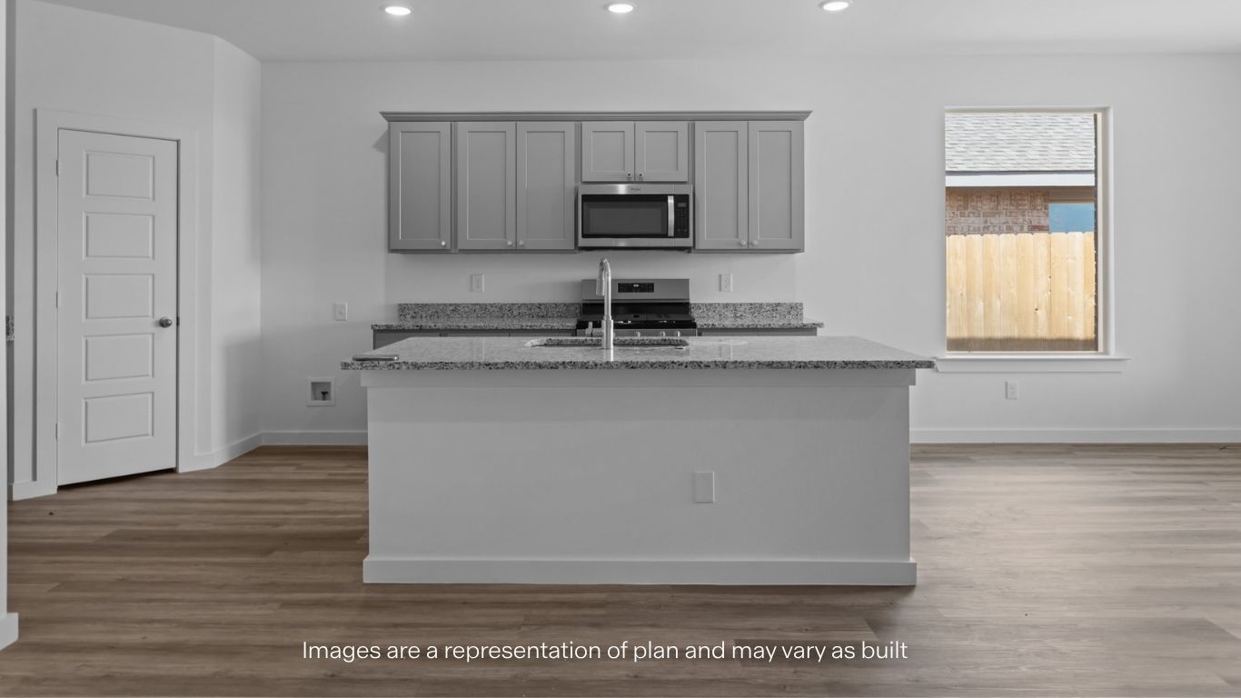 Spacious open concept kitchen with island and counter prep space