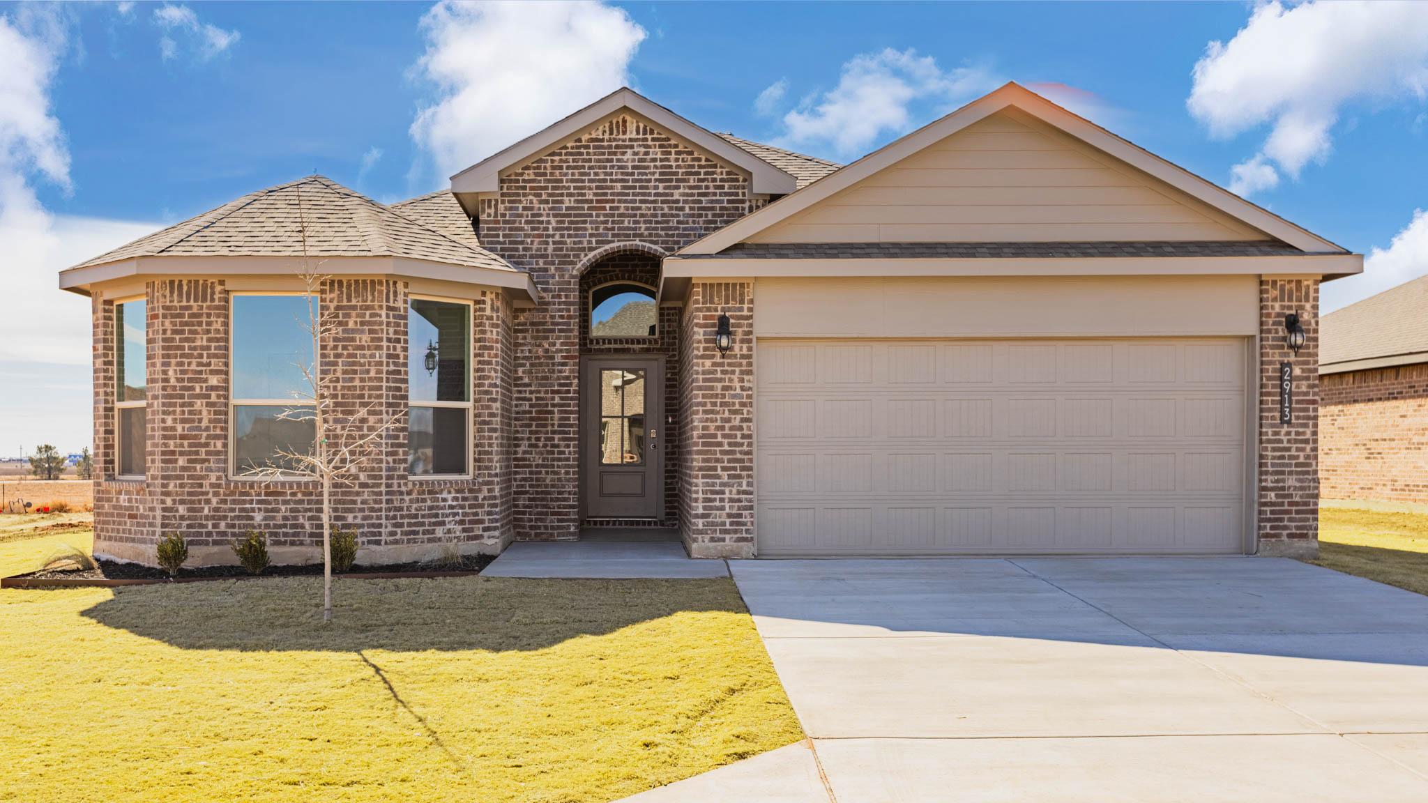 Exterior of single story modern brick style home