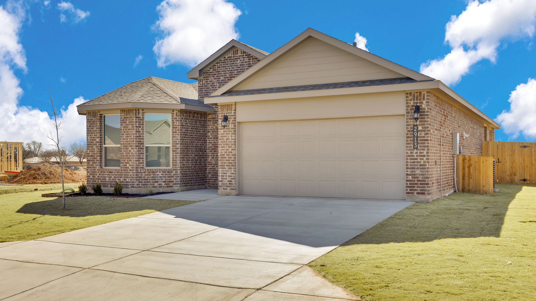 Side view of single story timeless brick home