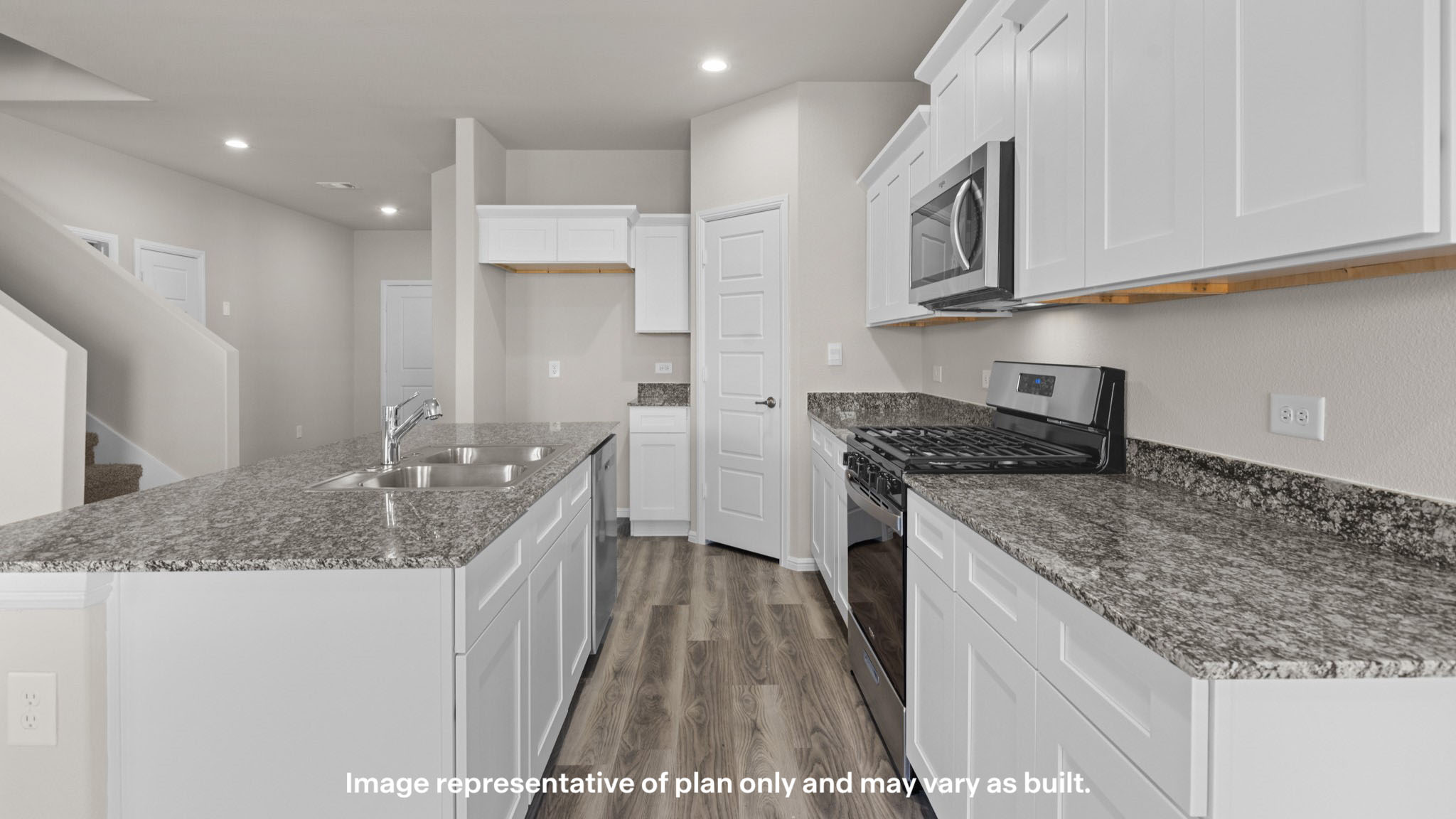 Spacious open concept kitchen with island and counter prep space