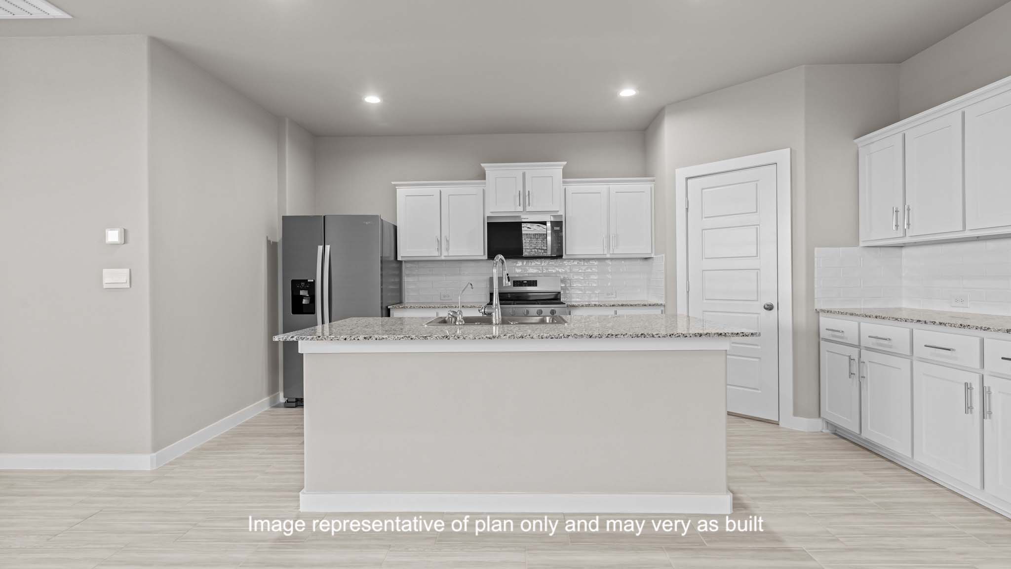 Spacious open concept kitchen with island and counter prep space