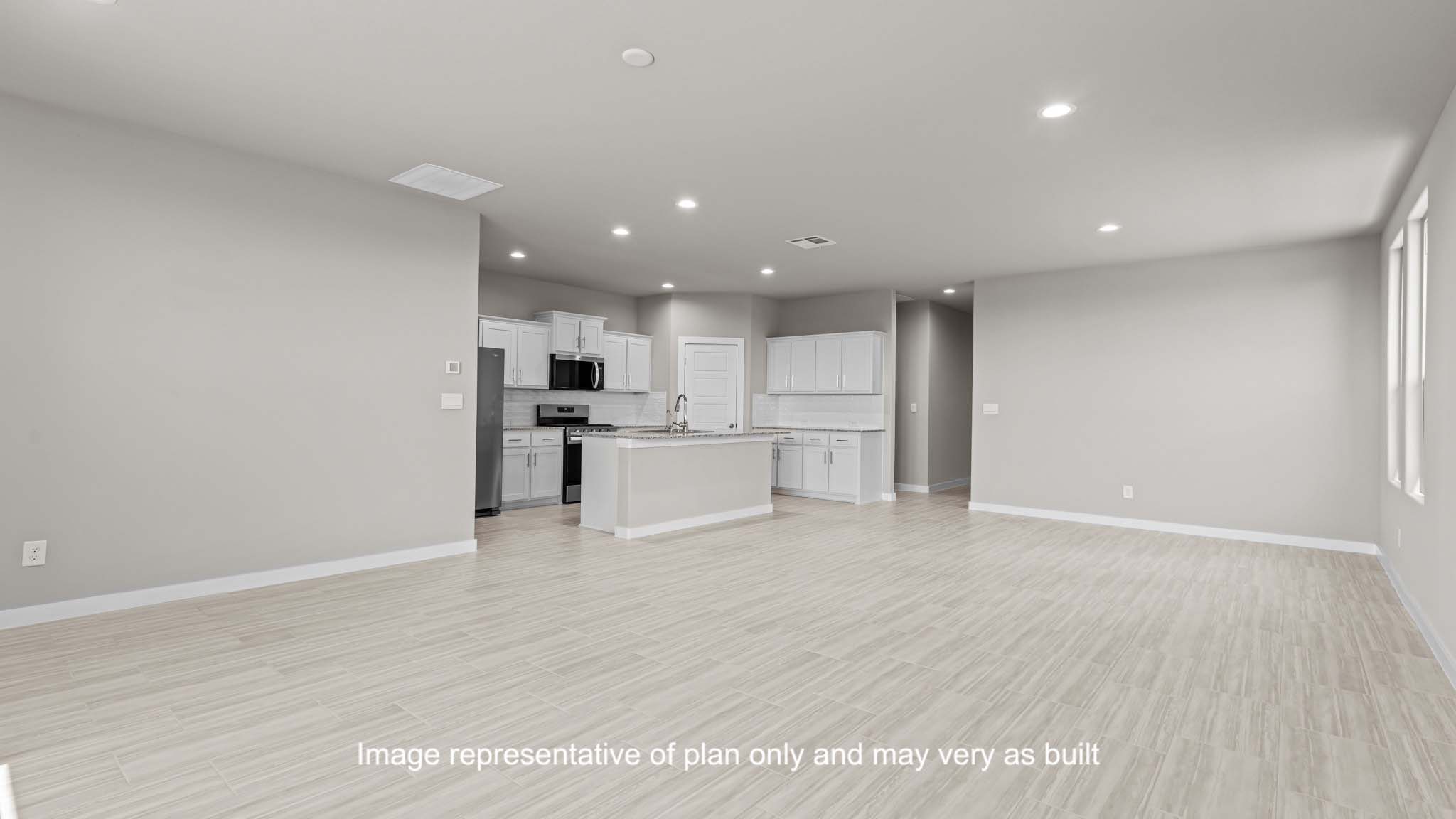 Open concept kitchen, living, family, and dining room space