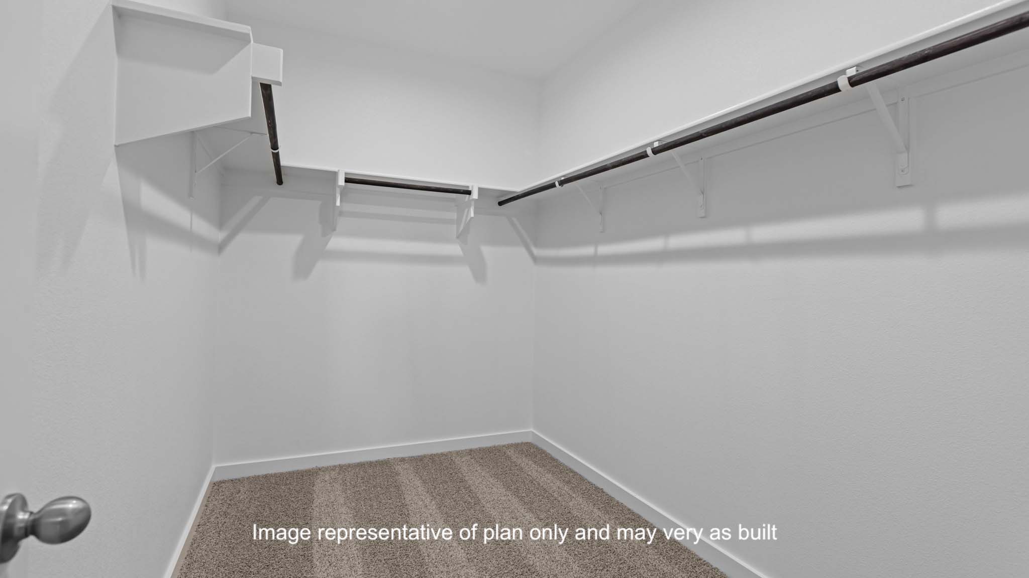Primary walk-in closet with extra storage space