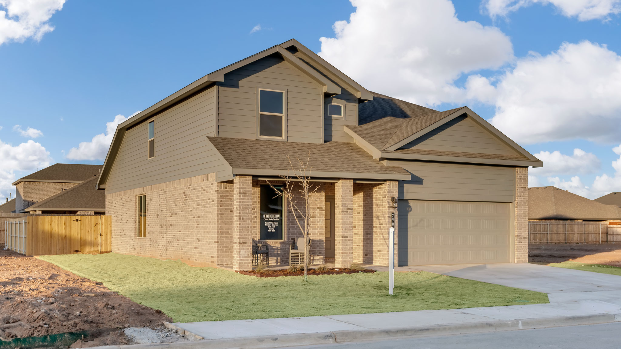 Side view of two story timeless brick home