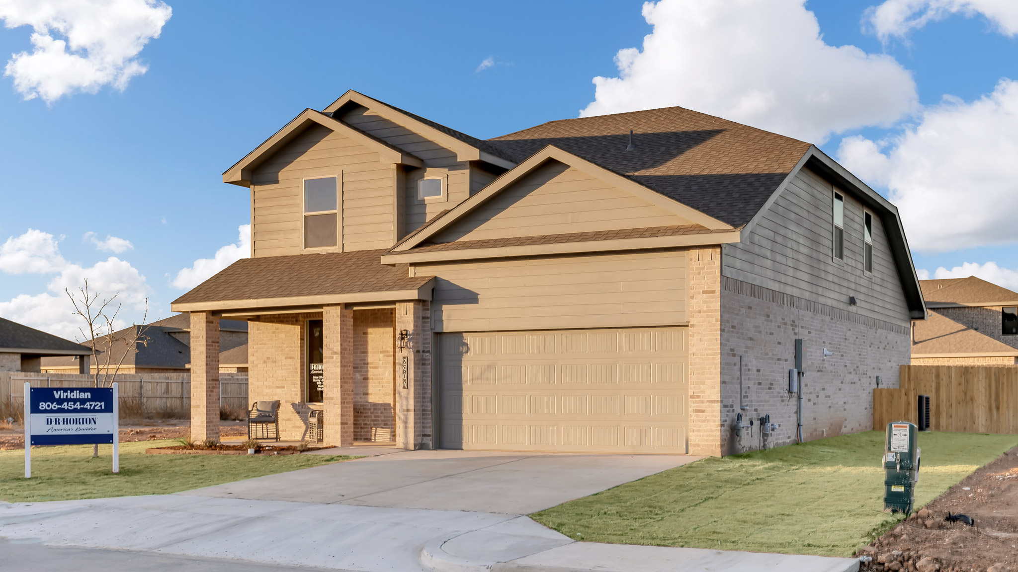 Side view of two story timeless brick home