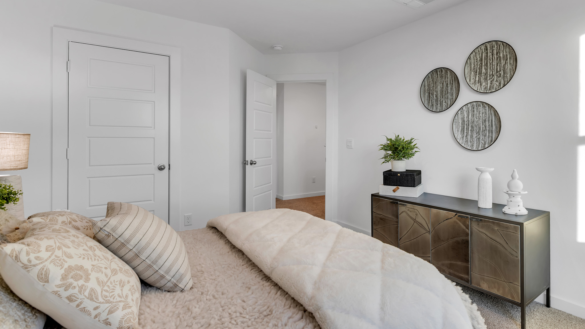 Guest bedroom 2 with plush carpet floors and spacious closet