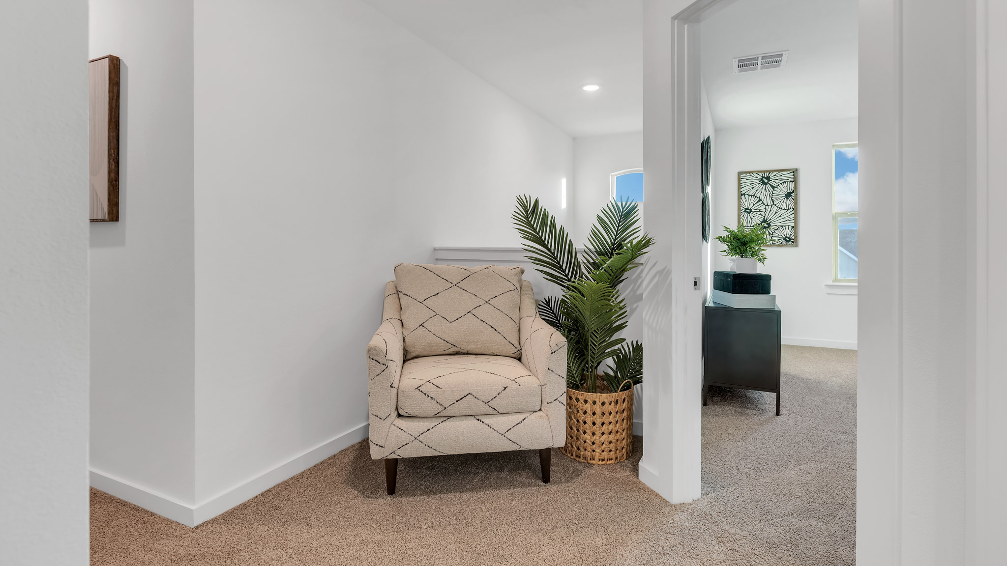 Cozy upstairs landing space with guest bedrooms and bathrooms on both sides