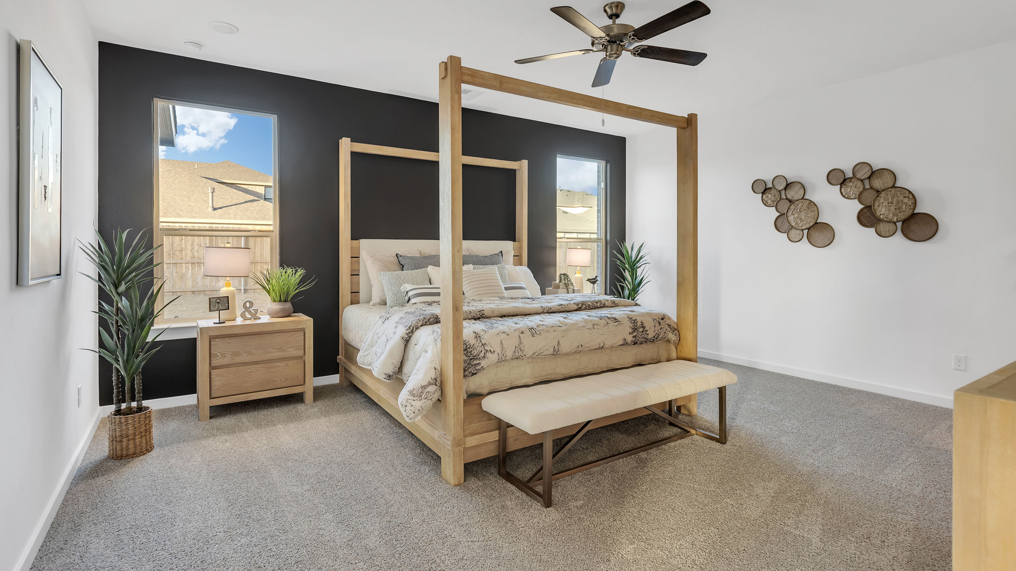 Primary bedroom with plush carpet floors and light allowing double windows