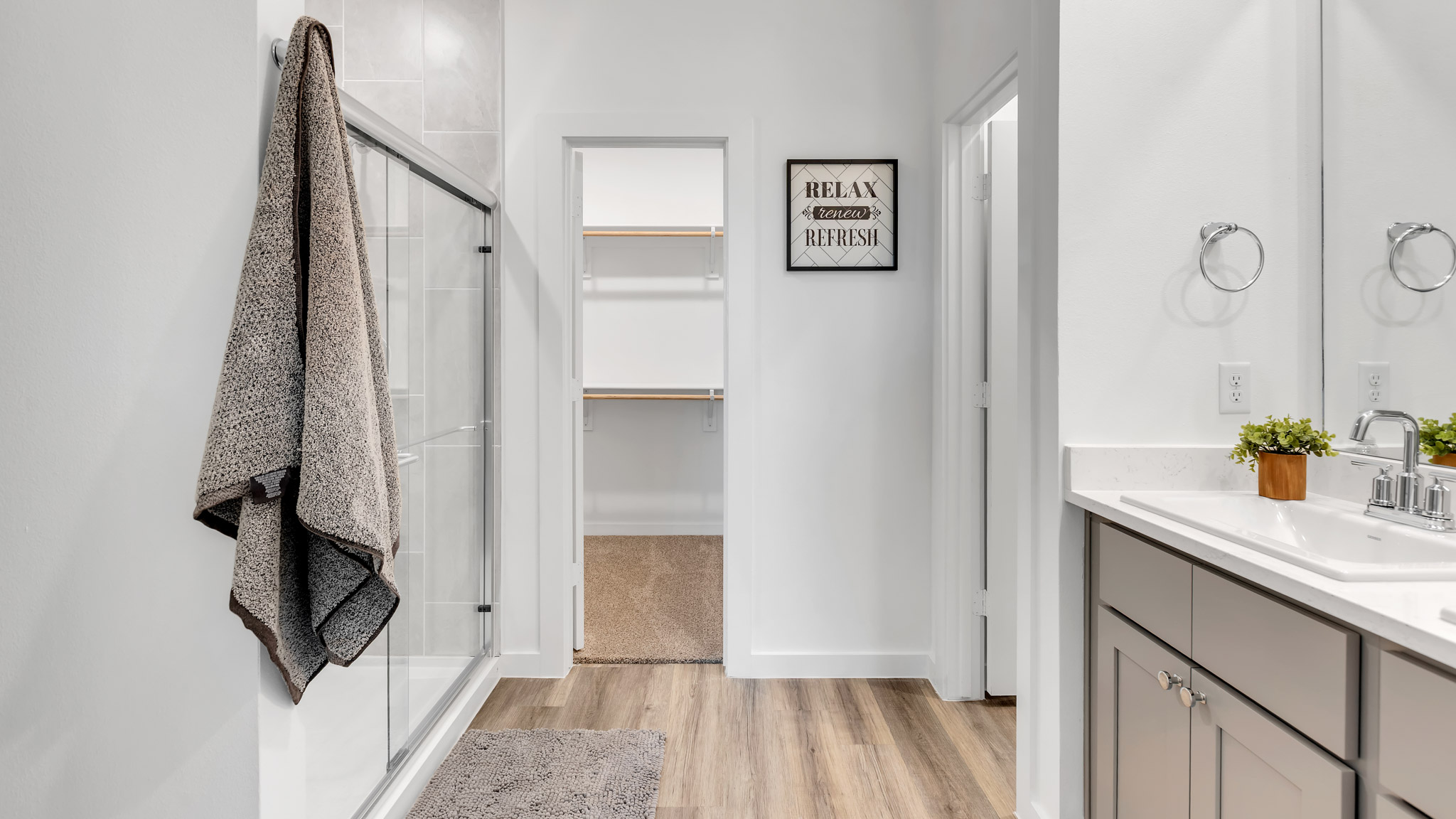 Primary bathroom with luxurious shower and built in storage