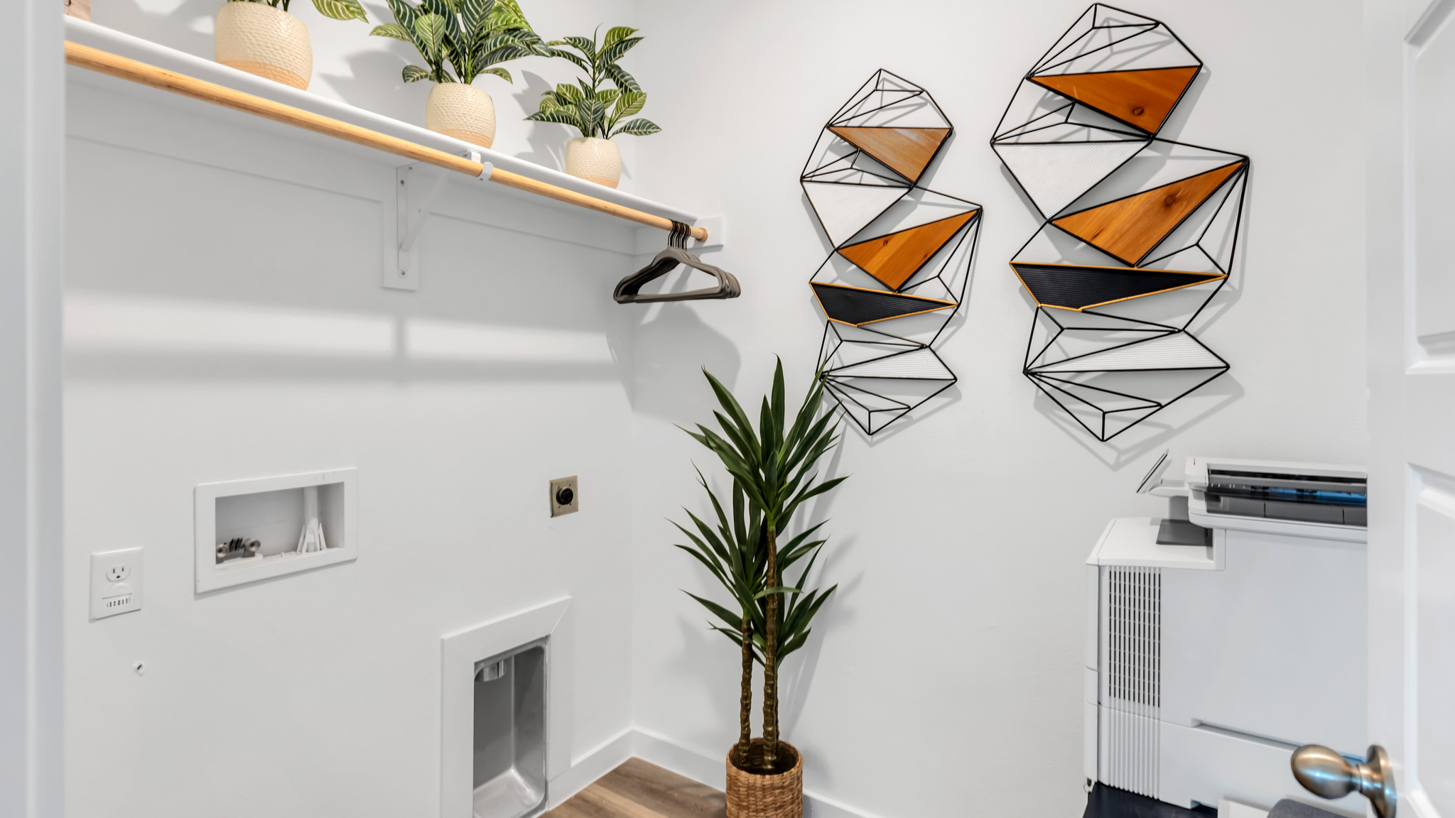 Laundry room and utility closet space with extra storage