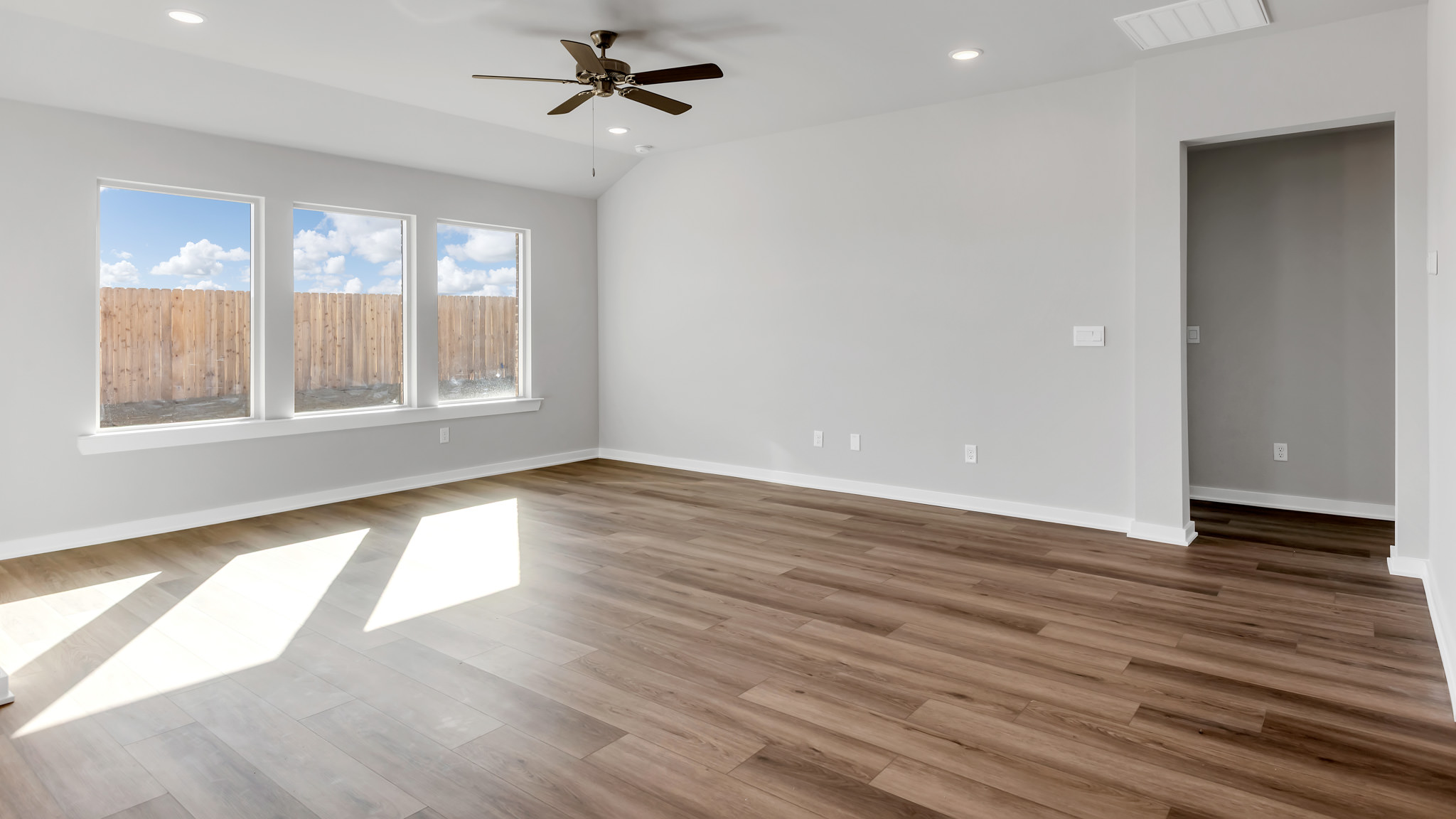 Open living and family room area with ample natural light