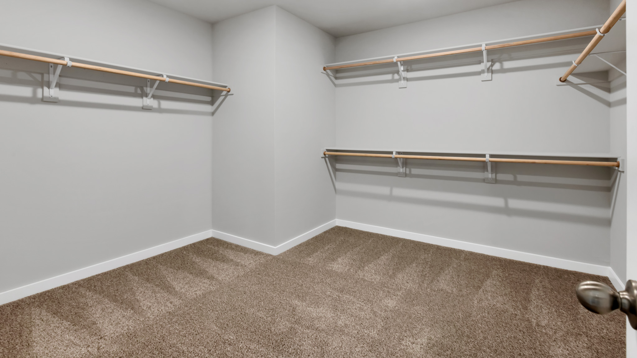 Primary walk-in closet with extra storage space