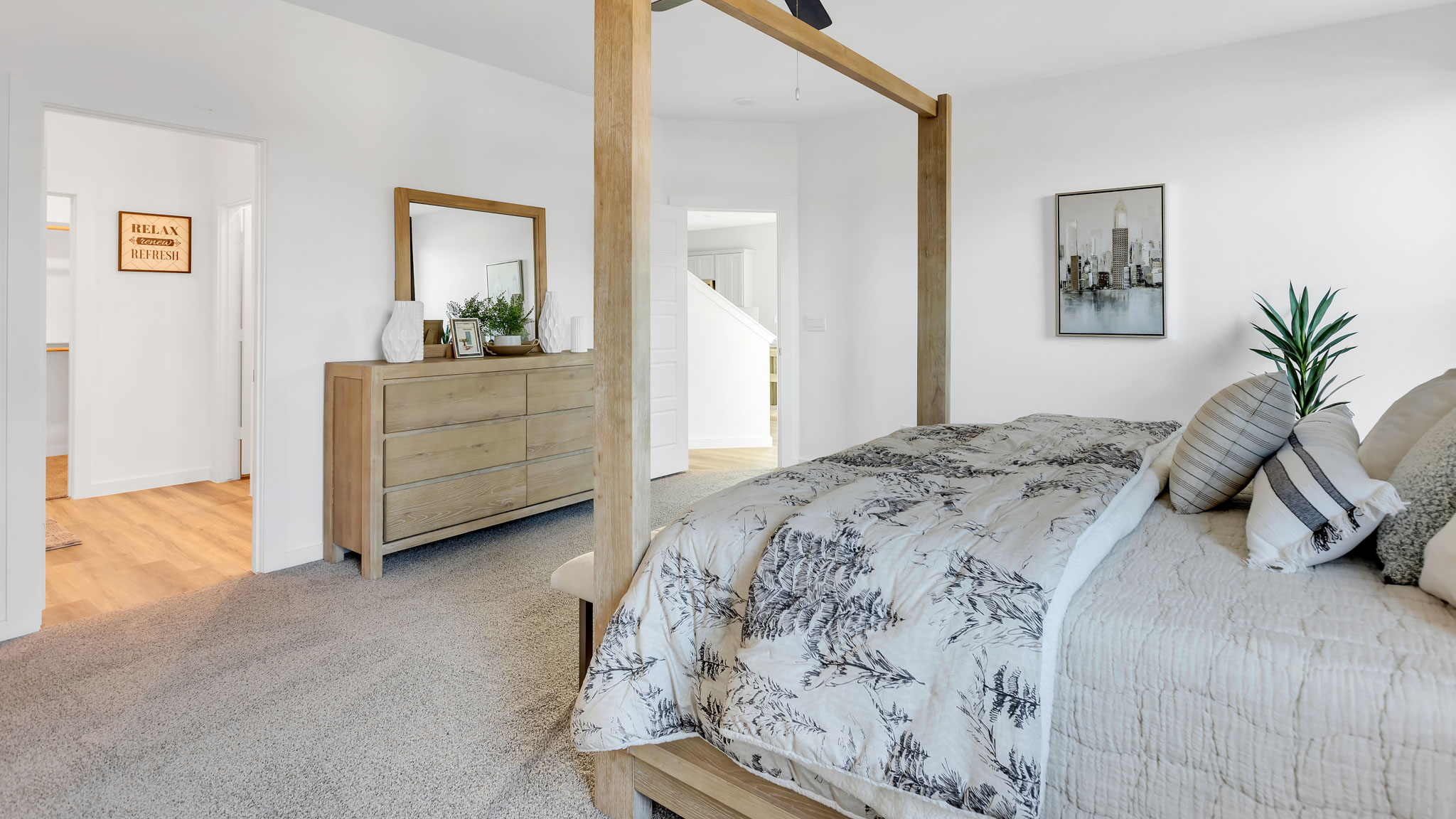 Primary bedroom with private attached bathroom and walk-in closet