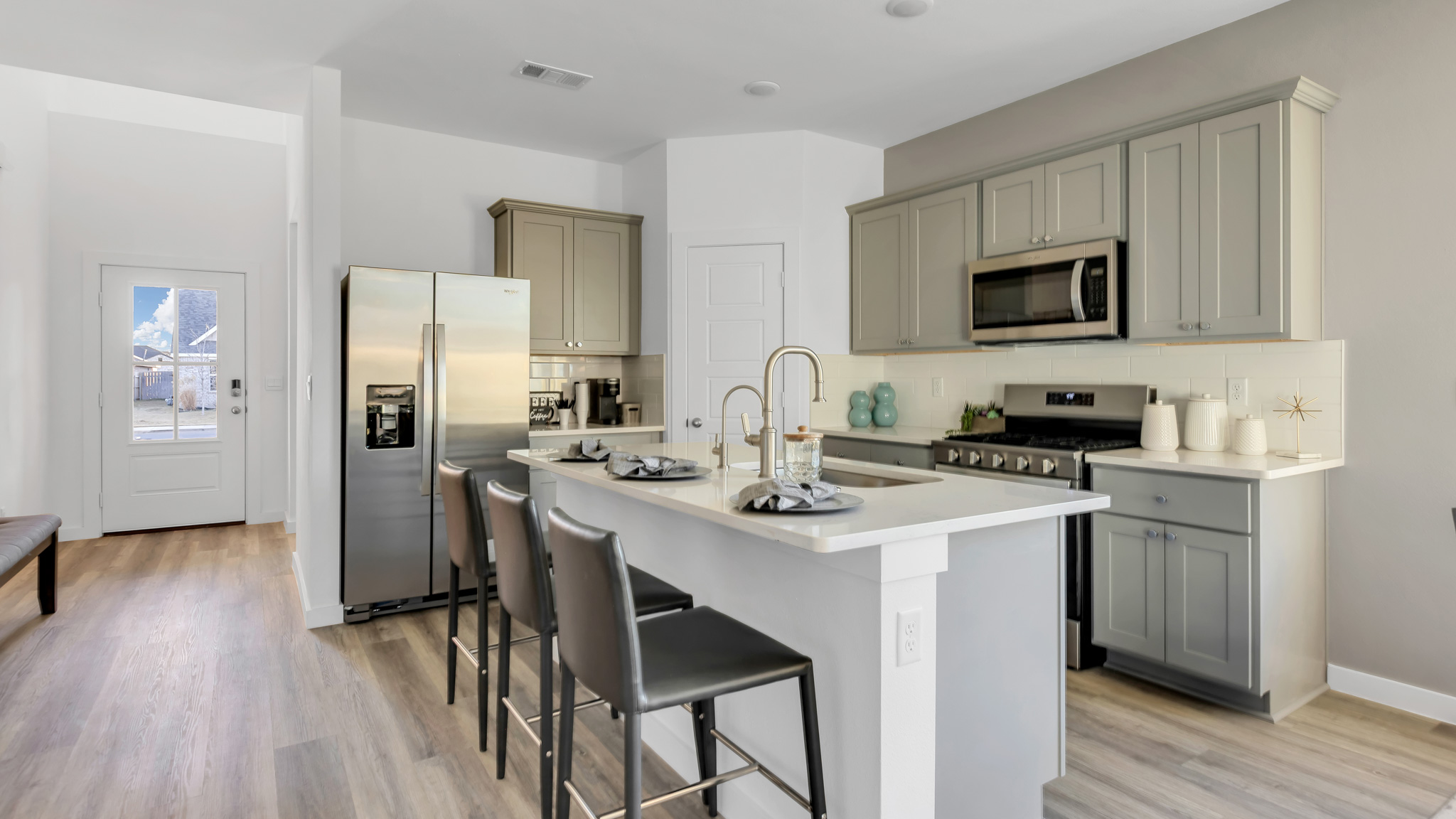 Spacious open concept kitchen with island and counter prep space