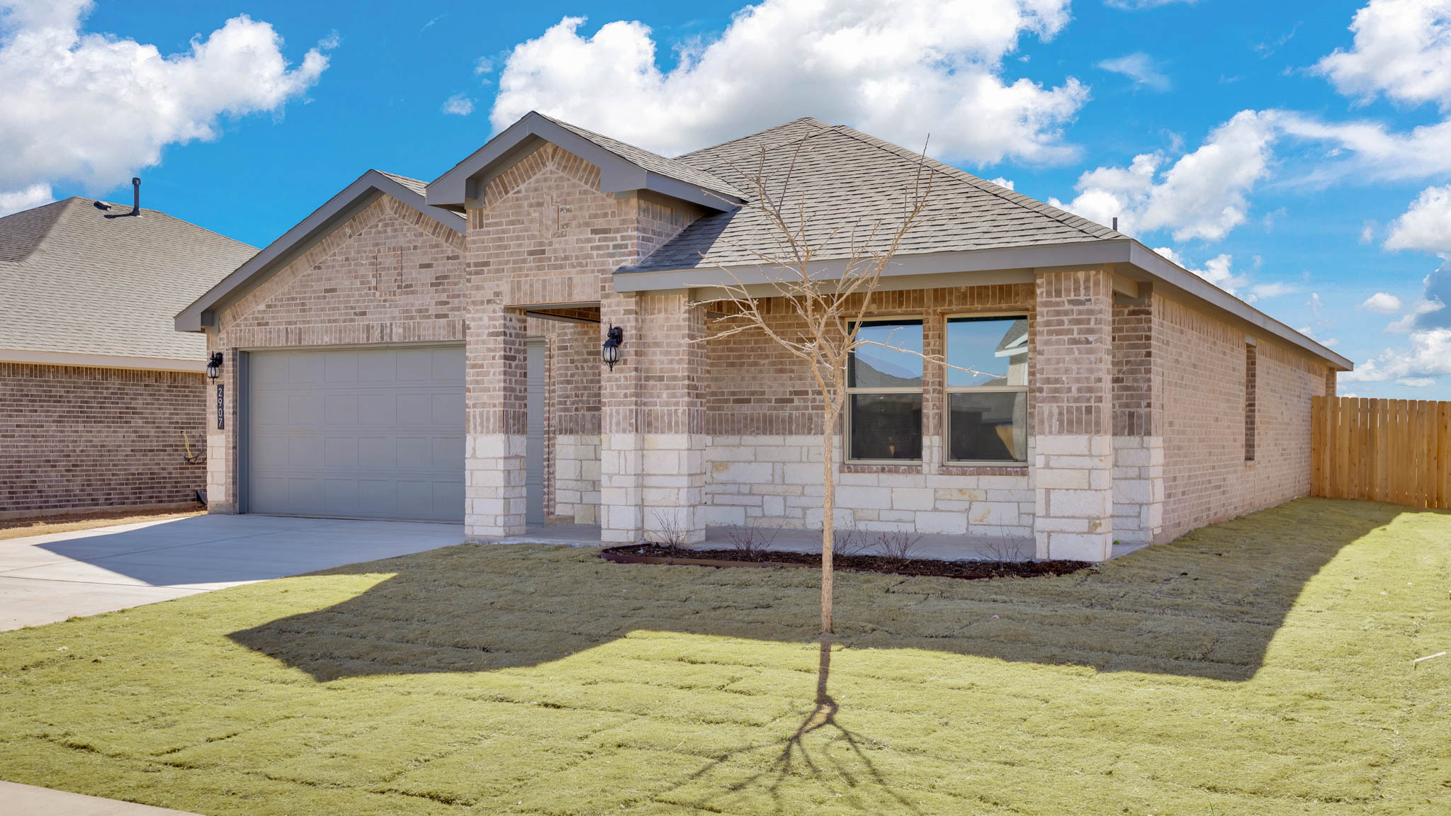Side view of single story timeless brick home