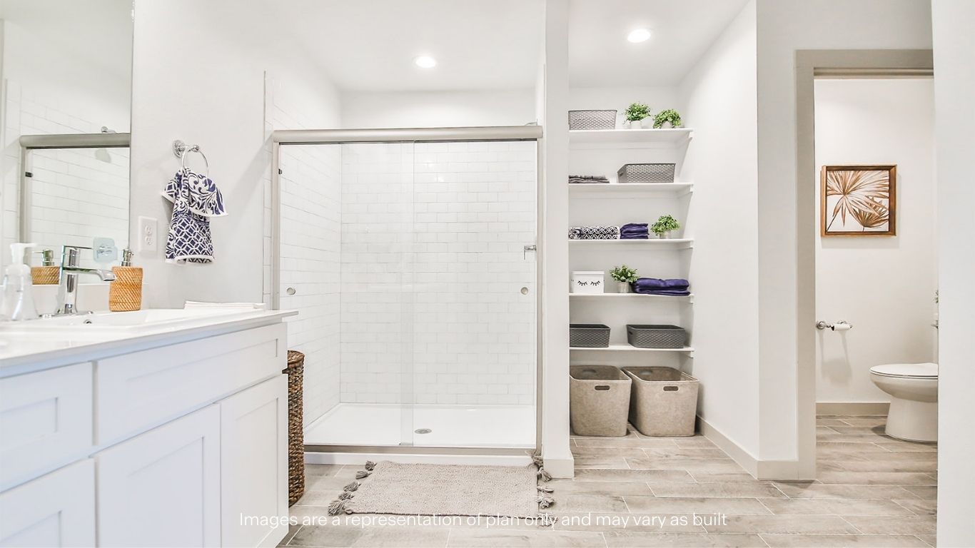 Primary bathroom with luxurious shower and built in storage