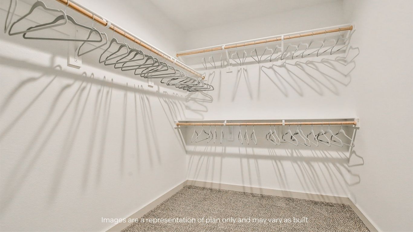 Primary walk-in closet with extra storage space