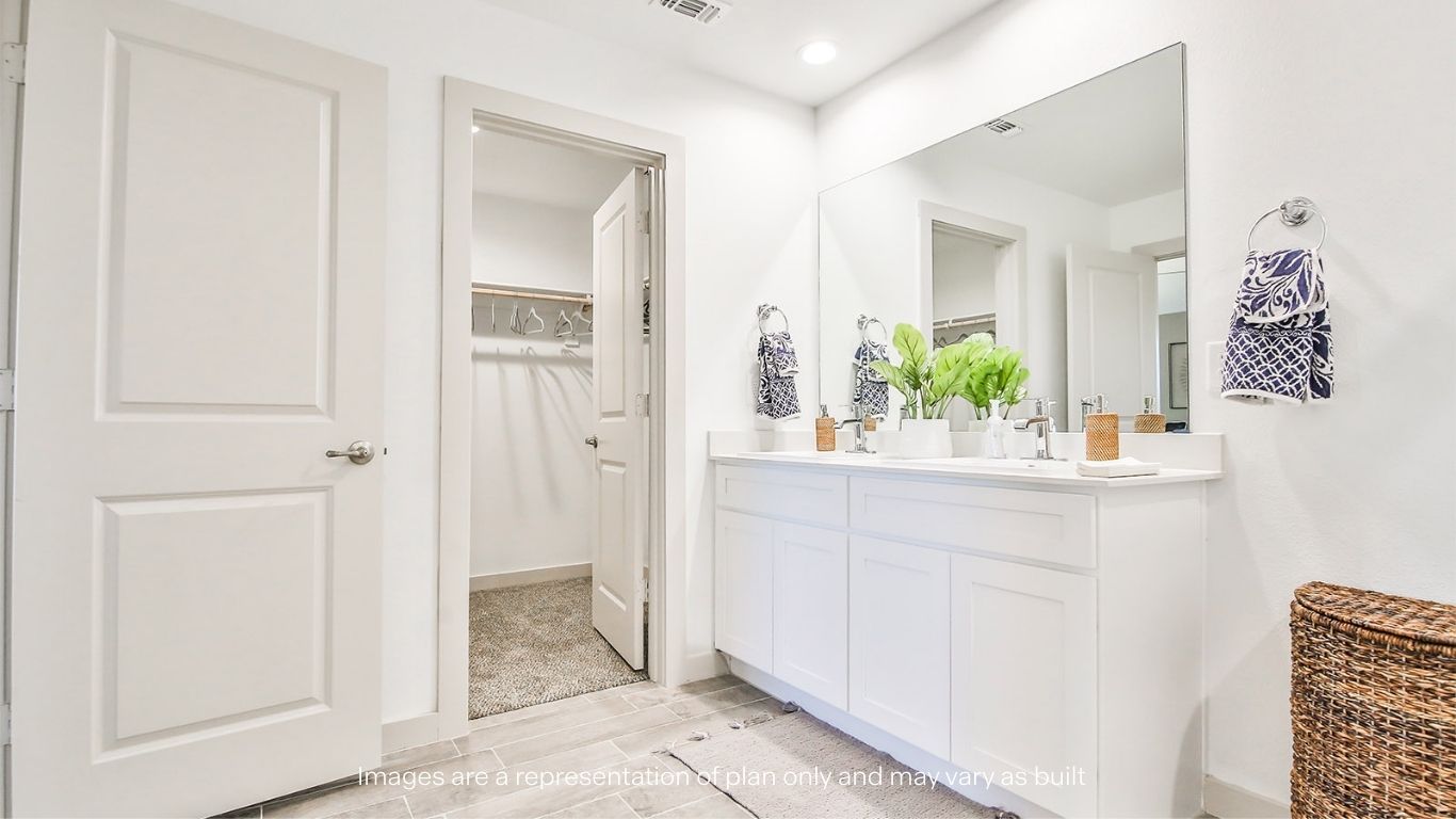 Private attached primary bathroom with built in vanity