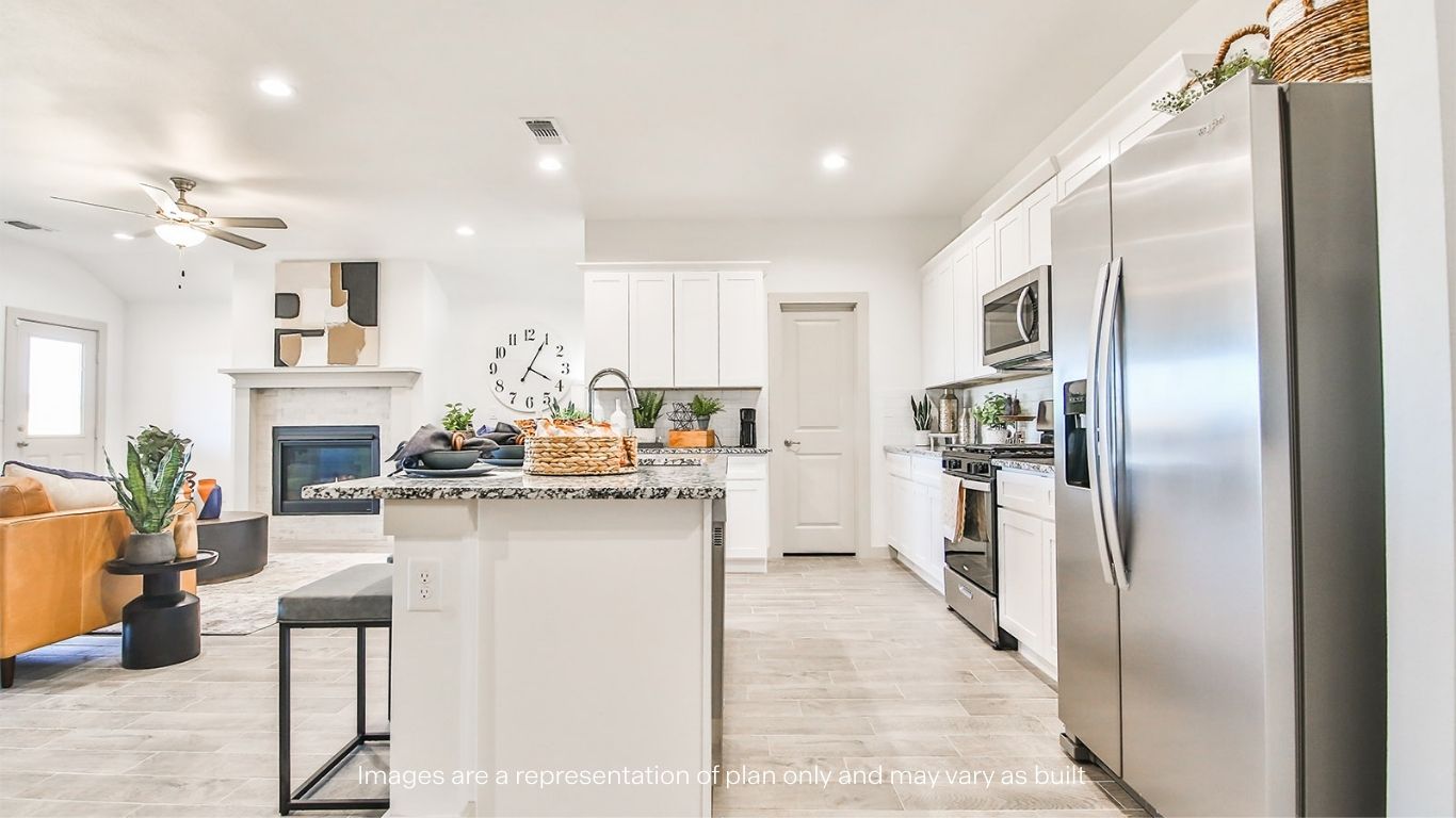 Spacious open concept kitchen with island and counter prep space