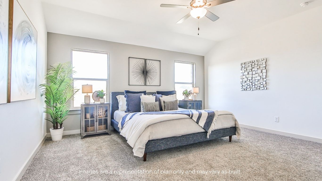 Primary bedroom with plush carpet floors and light allowing double windows